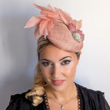 Blush pink feather pearl fascinator hat Blush pink feather pearl fascinator hat