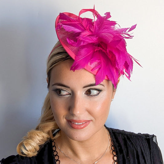Fuchsia pink feather disc saucer fascinator hat