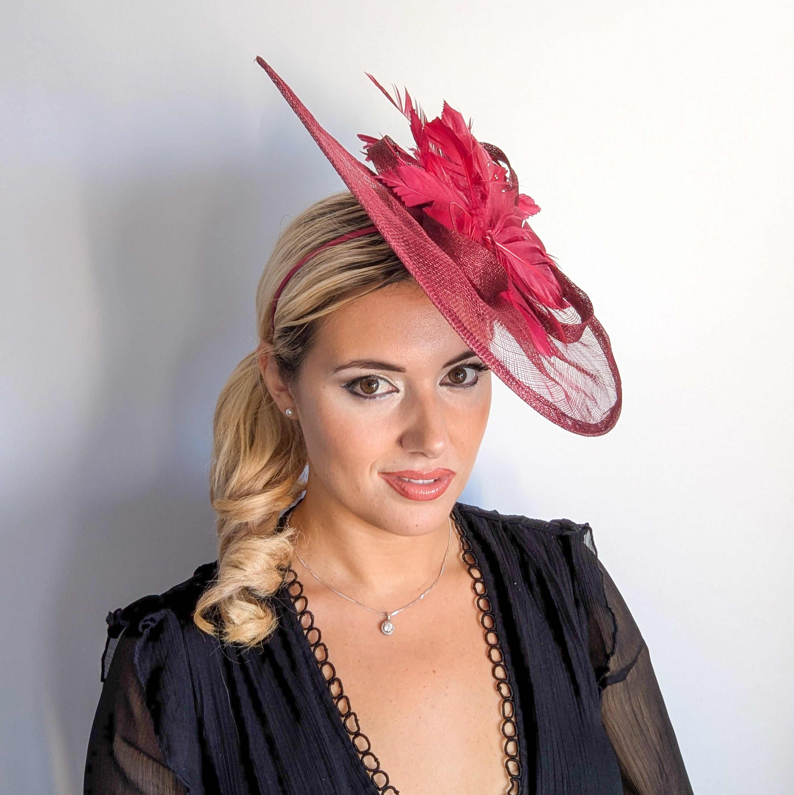 Burgundy feather large teardrop fascinator hat Burgundy feather large teardrop fascinator hat