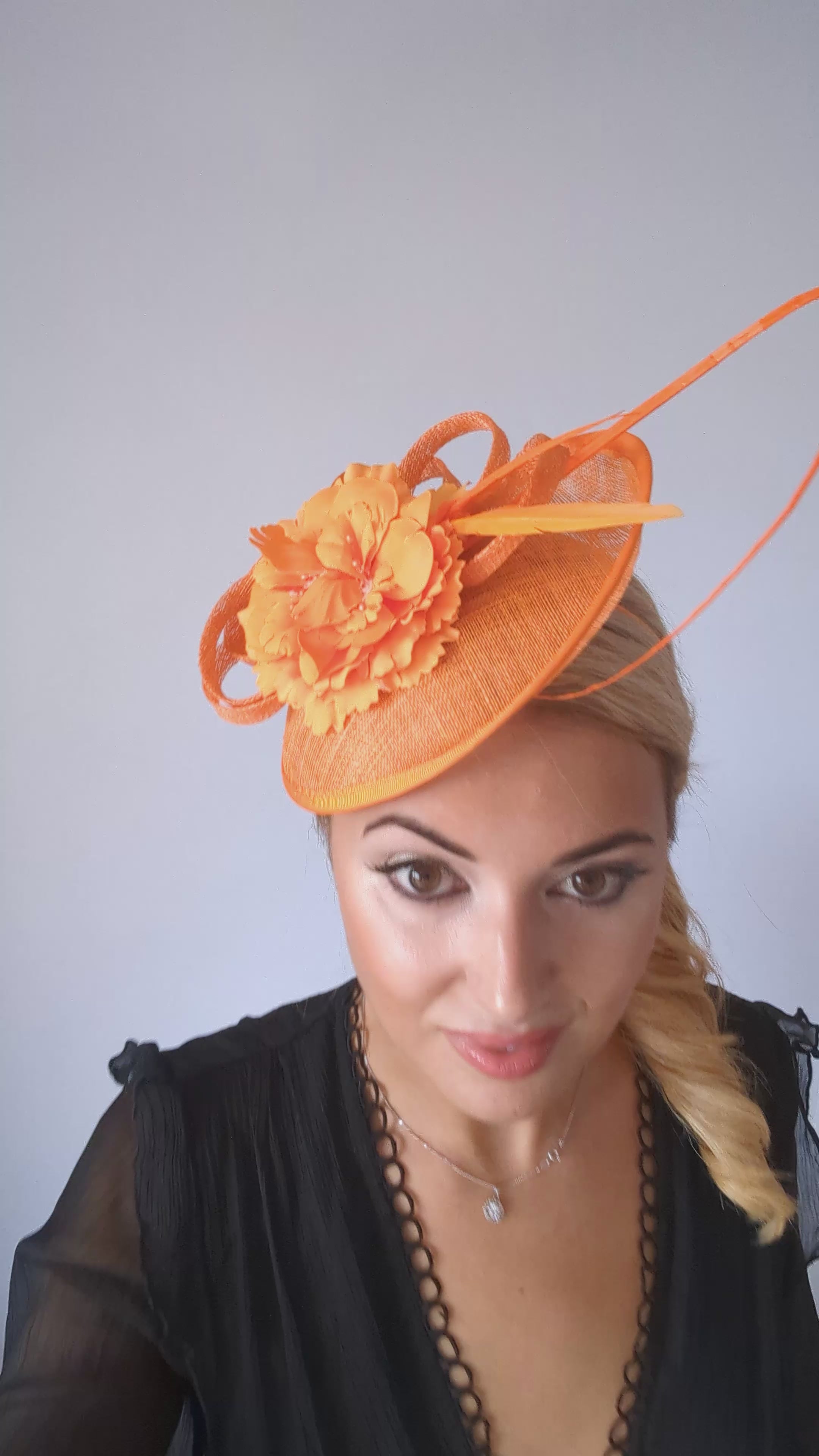 Orange flower fascinator disc saucer hat Orange flower fascinator disc saucer hat