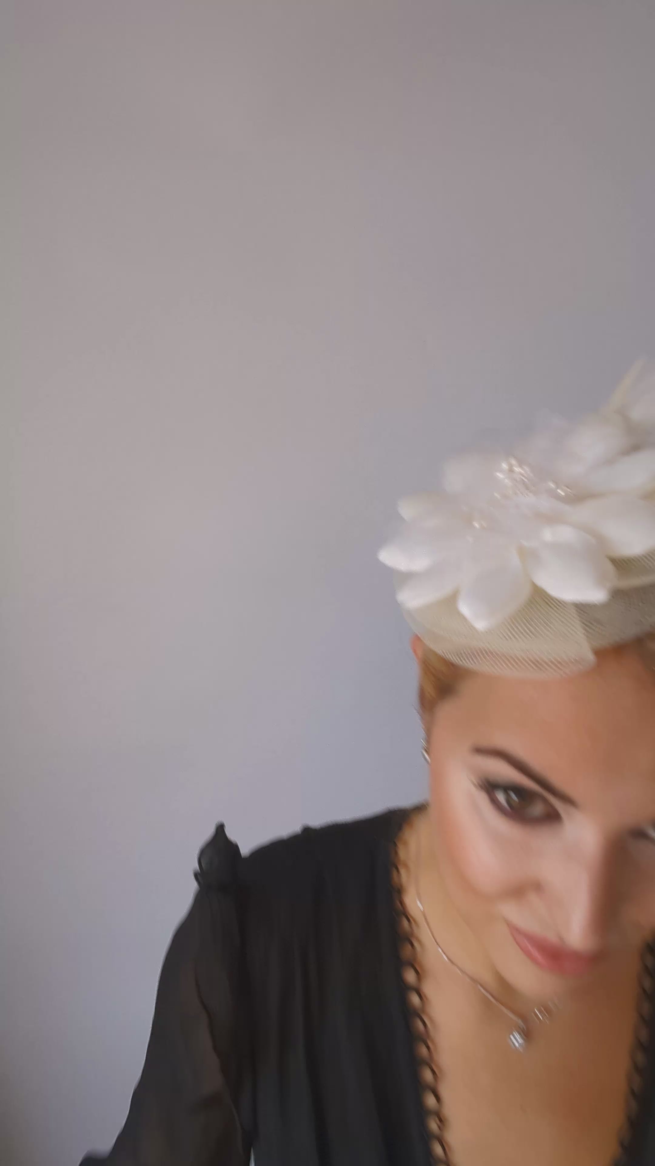 Cream feather flower fascinator hat Cream feather flower fascinator hat
