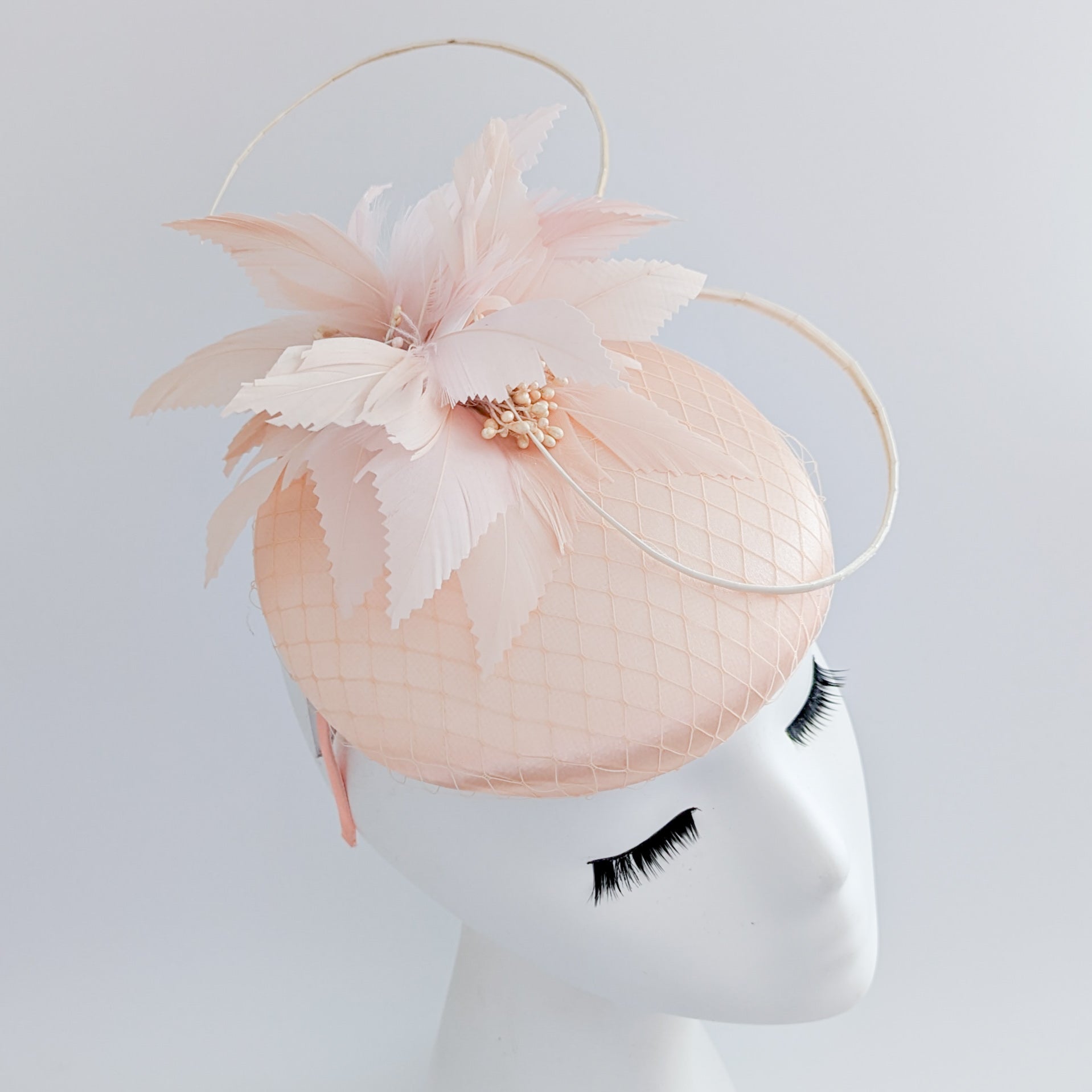 Peach feather satin fascinator hat