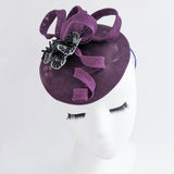 Cappello fascinator fiore viola melanzana