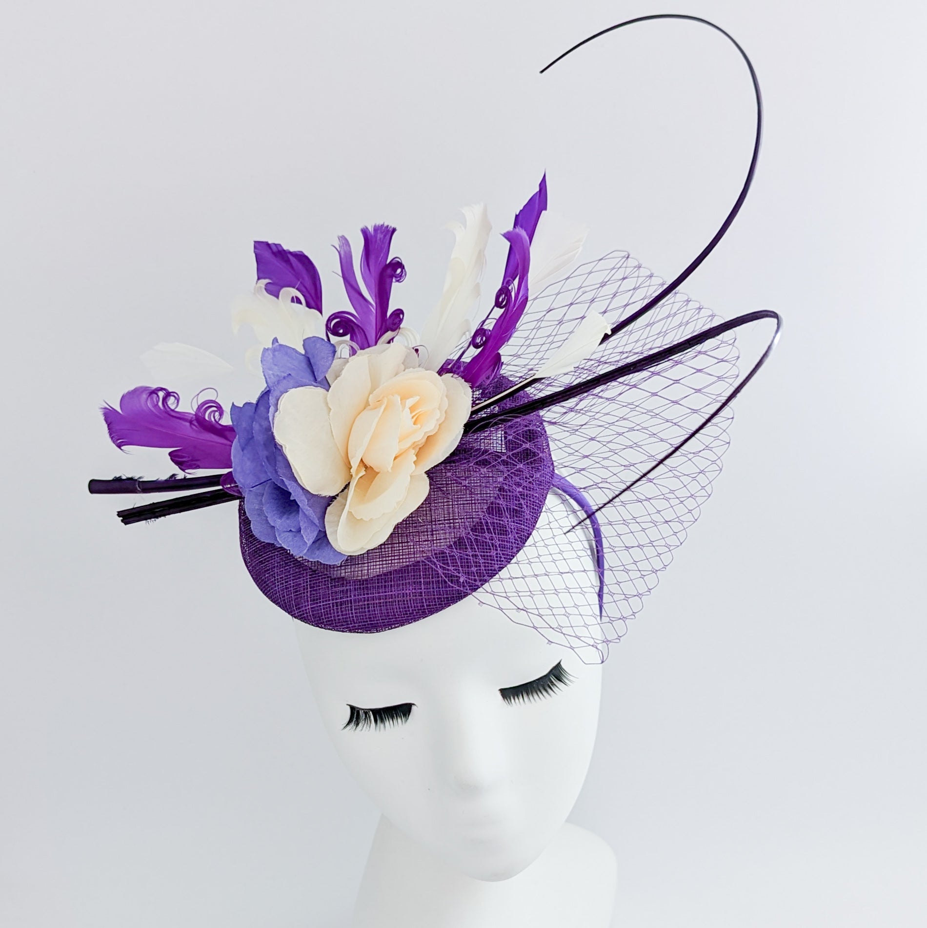 Cadbury purple flower feather fascinator hat