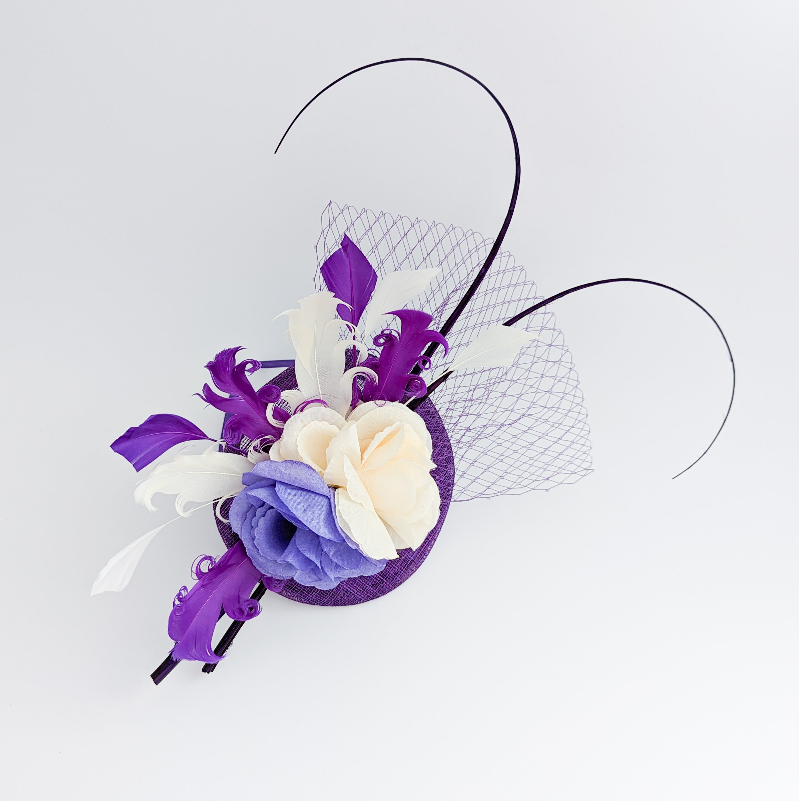 Cadbury purple flower feather fascinator hat