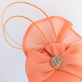 Cappello fascinator con fiocco in cristallo corallo