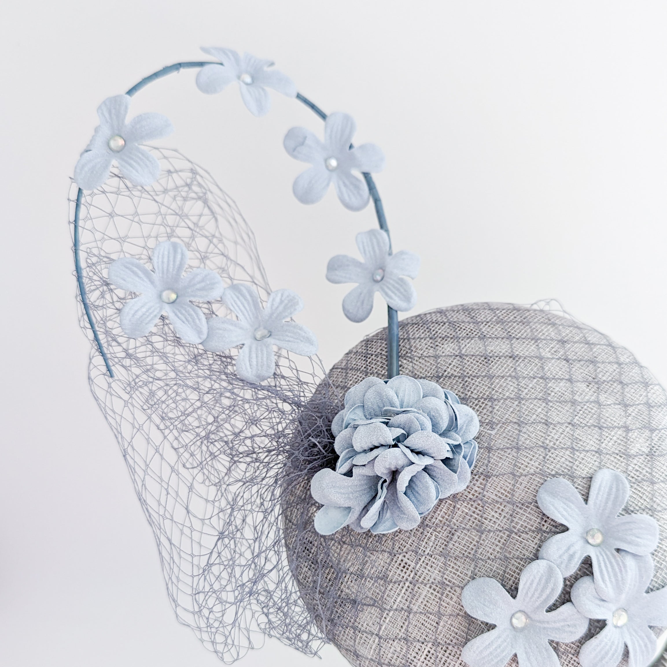 Light dusty blue flower fascinator hat