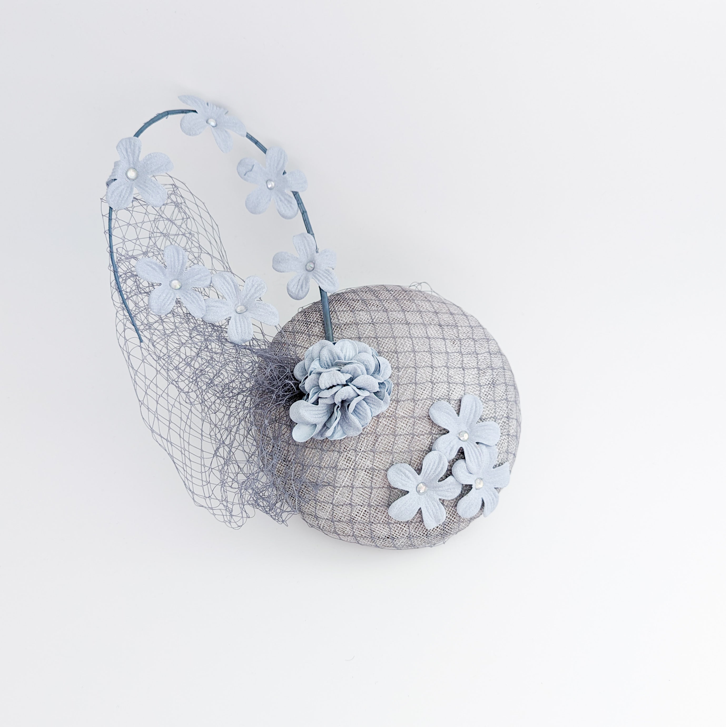 Light dusty blue flower fascinator hat