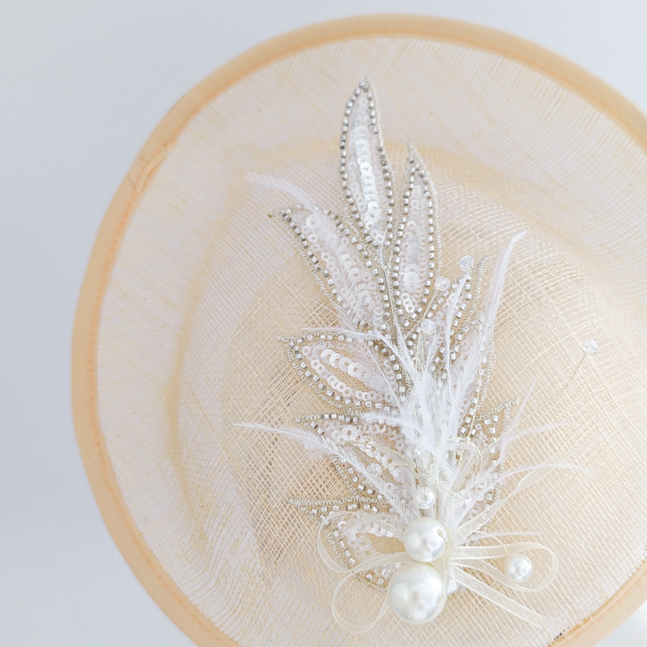 Peach crystal feather disc saucer fascinator hat