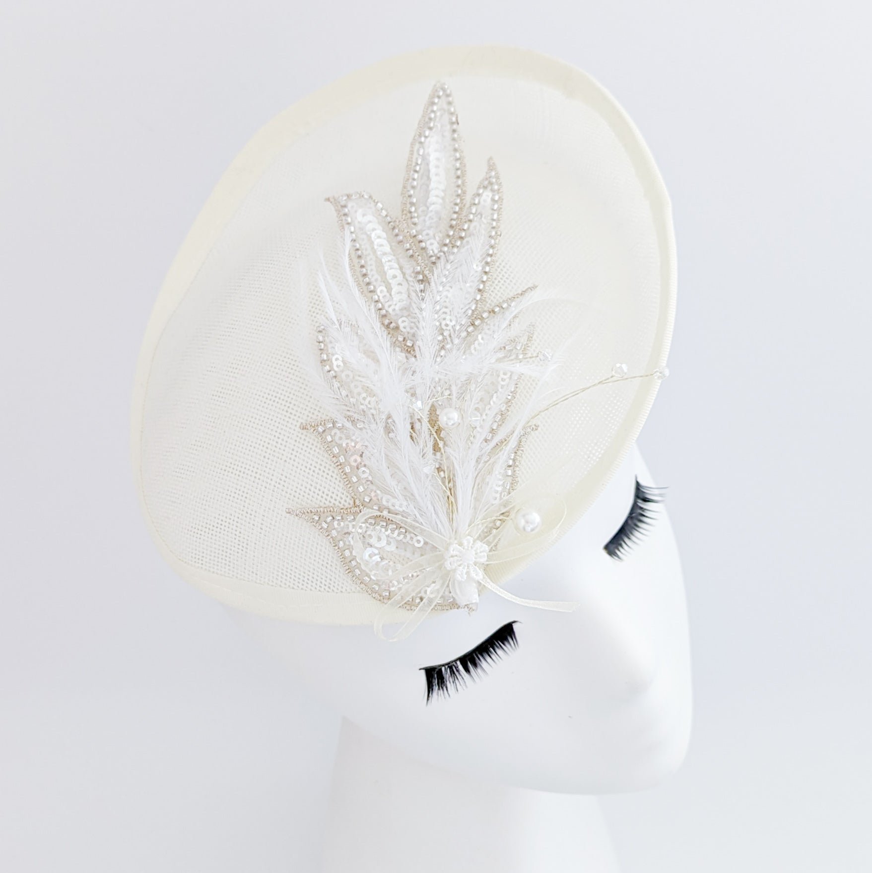 Cream crystal feather disc saucer fascinator hat