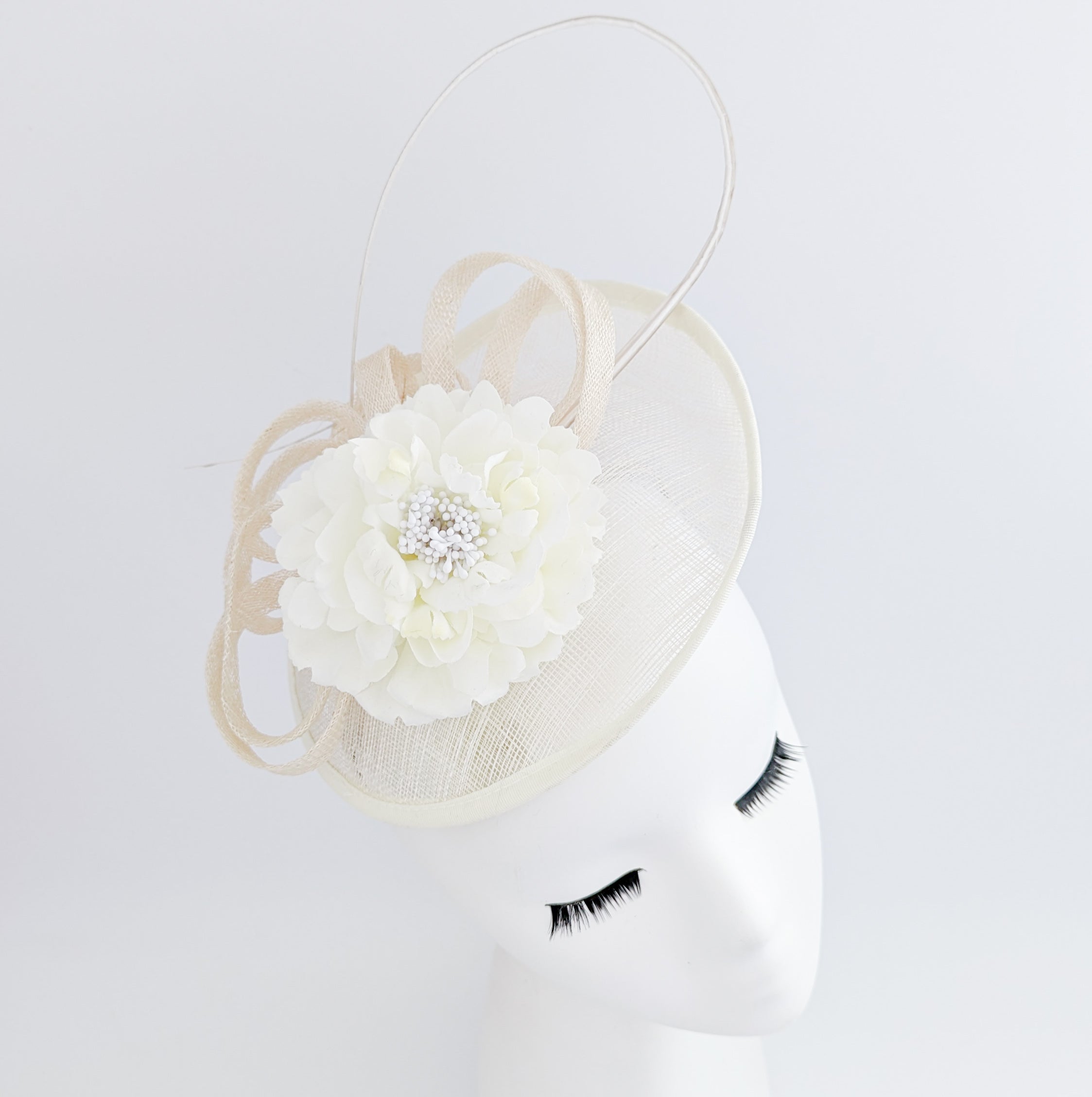 Cream flower disc saucer fascinator hat