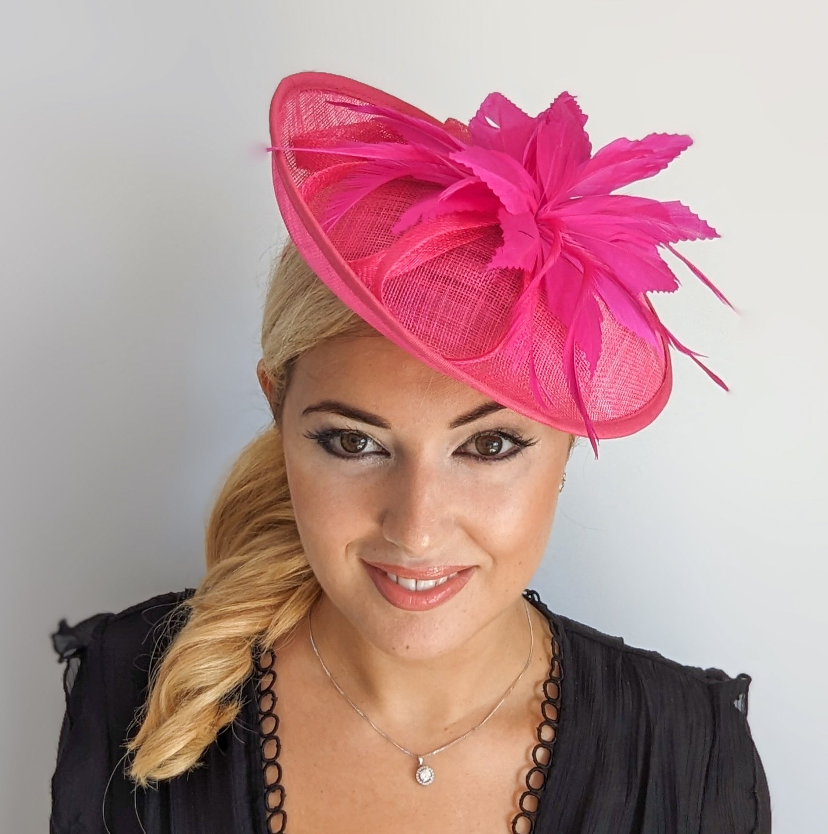 Fuchsia pink feather disc saucer fascinator hat