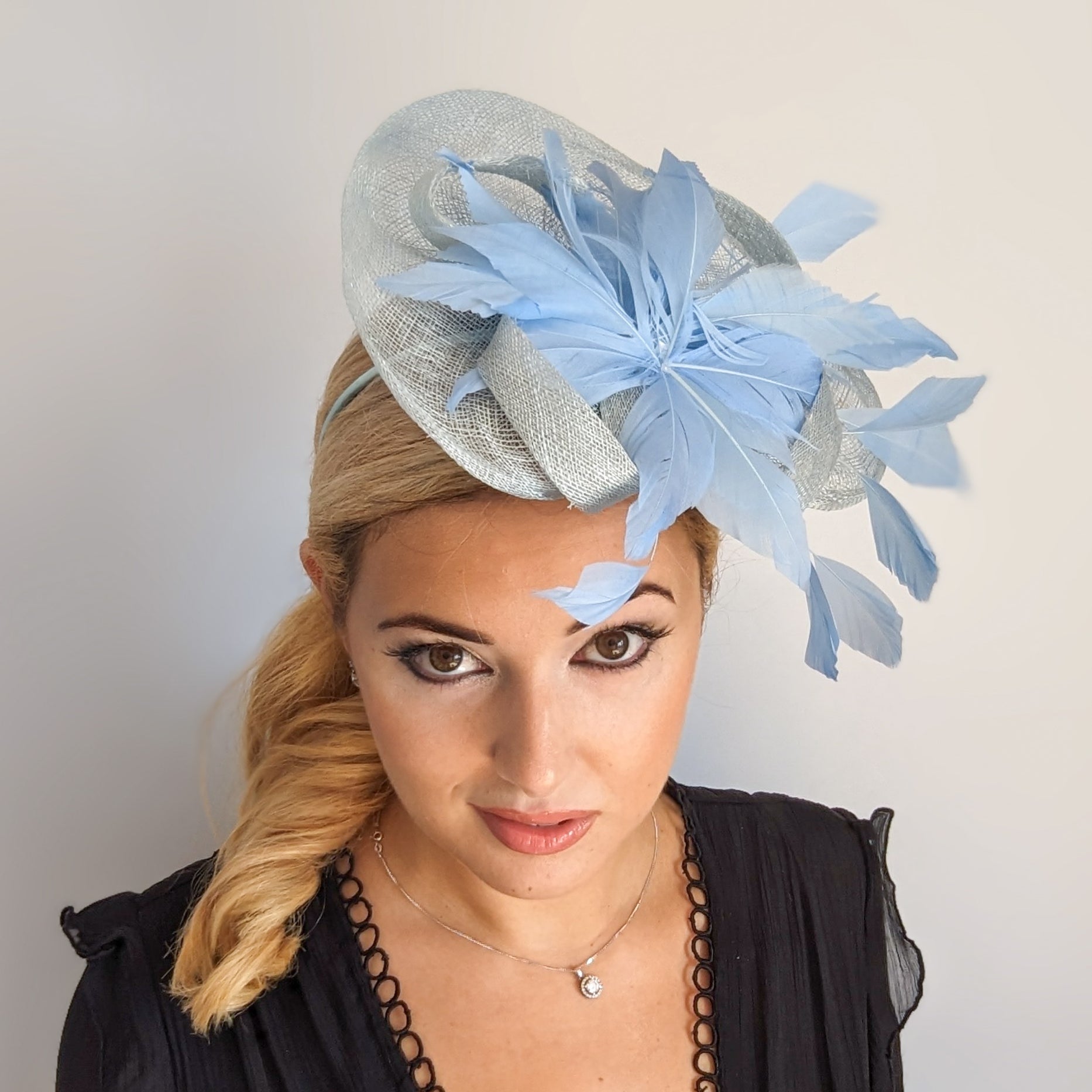 Aquamarine cornflower blue feather fascinator hat