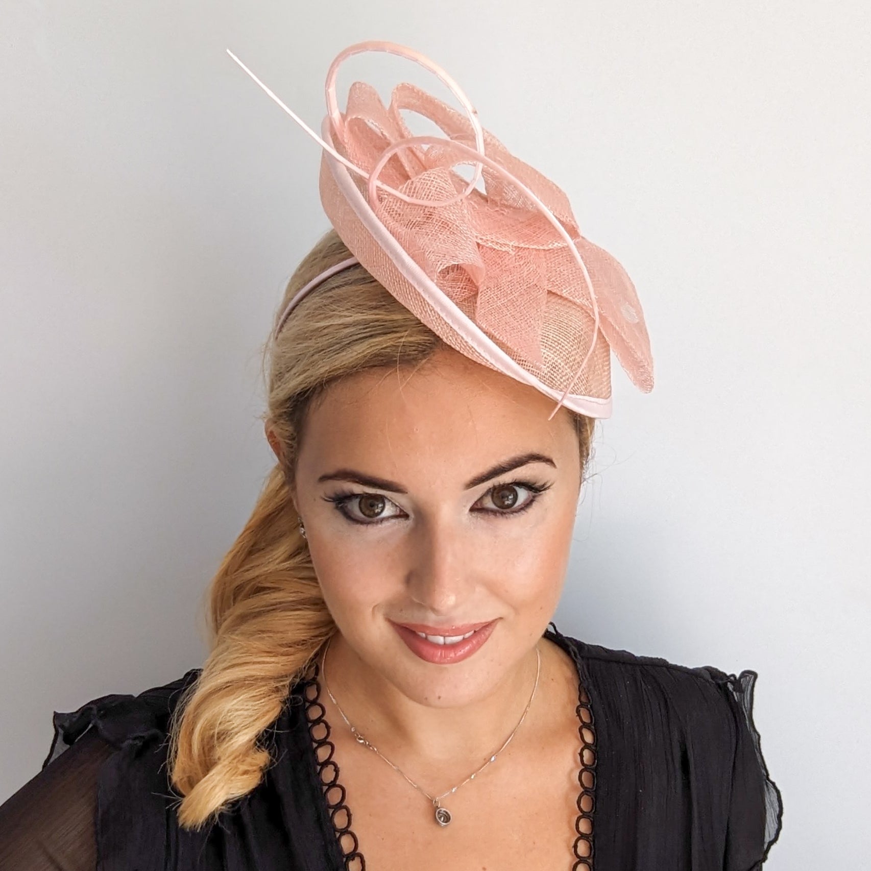 Light pink disc saucer fascinator hat