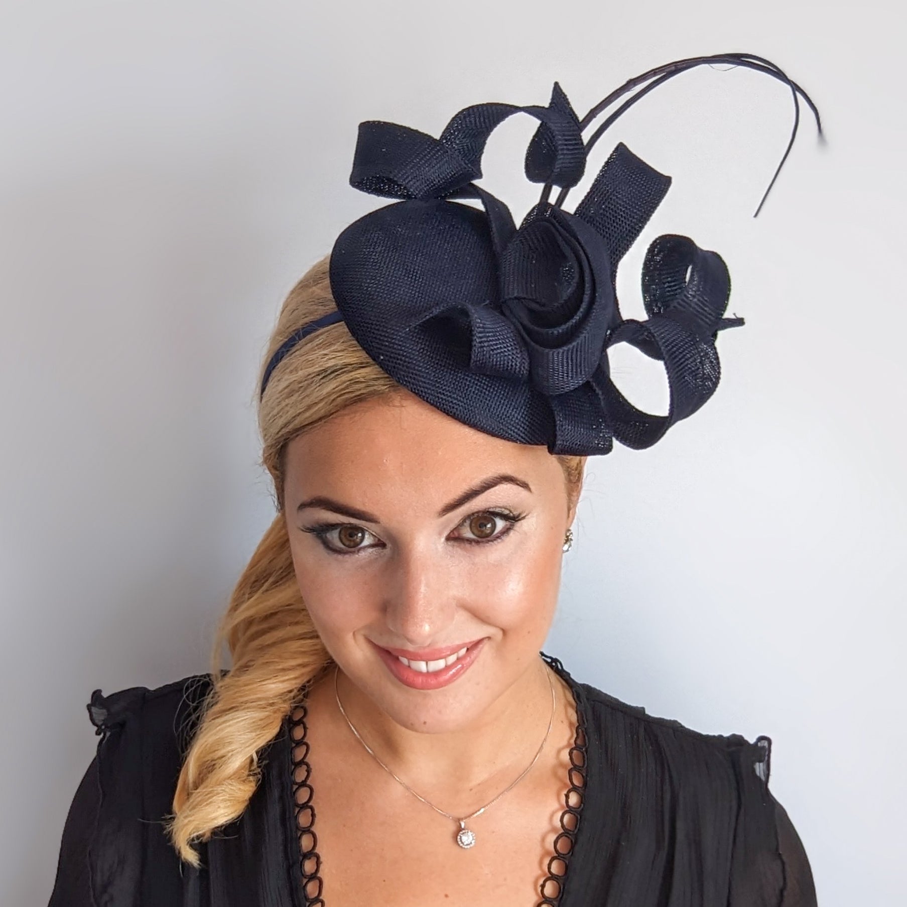 Navy blue spiral loop fascinator hat