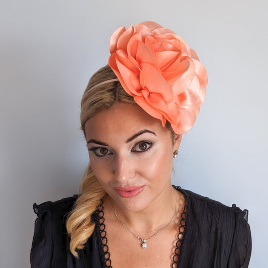 Large peach satin rose fascinator hat