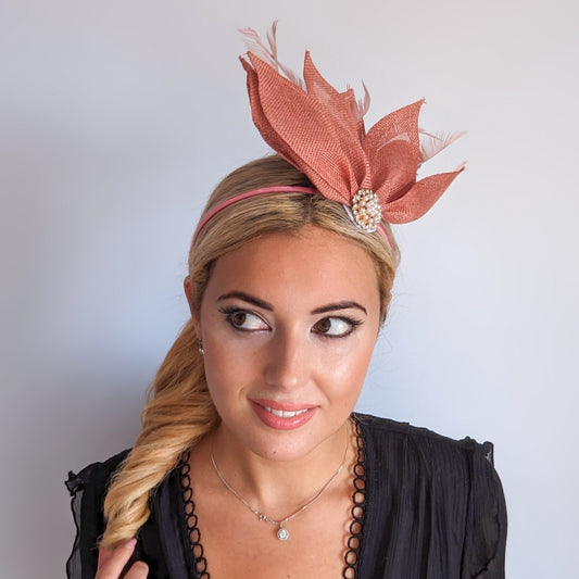 Terracotta dusty pink feather petal fan fascinator hat