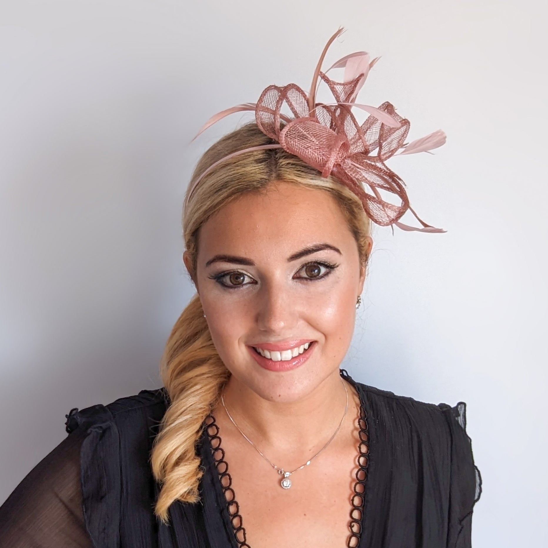 Blush pink feather fascinator hat