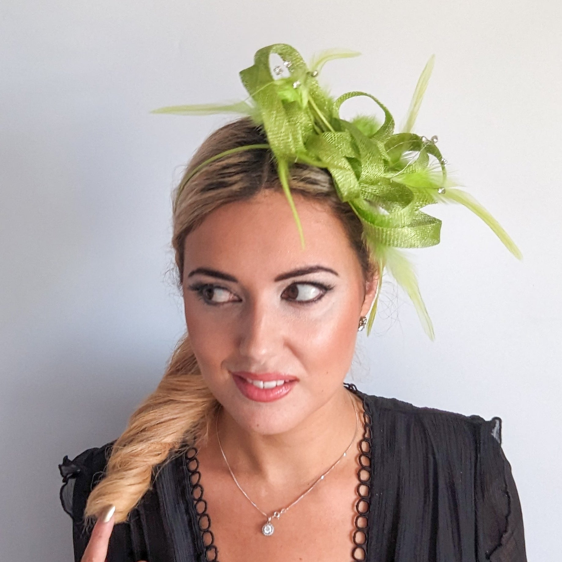 Lime green crystal feather fascinator hat