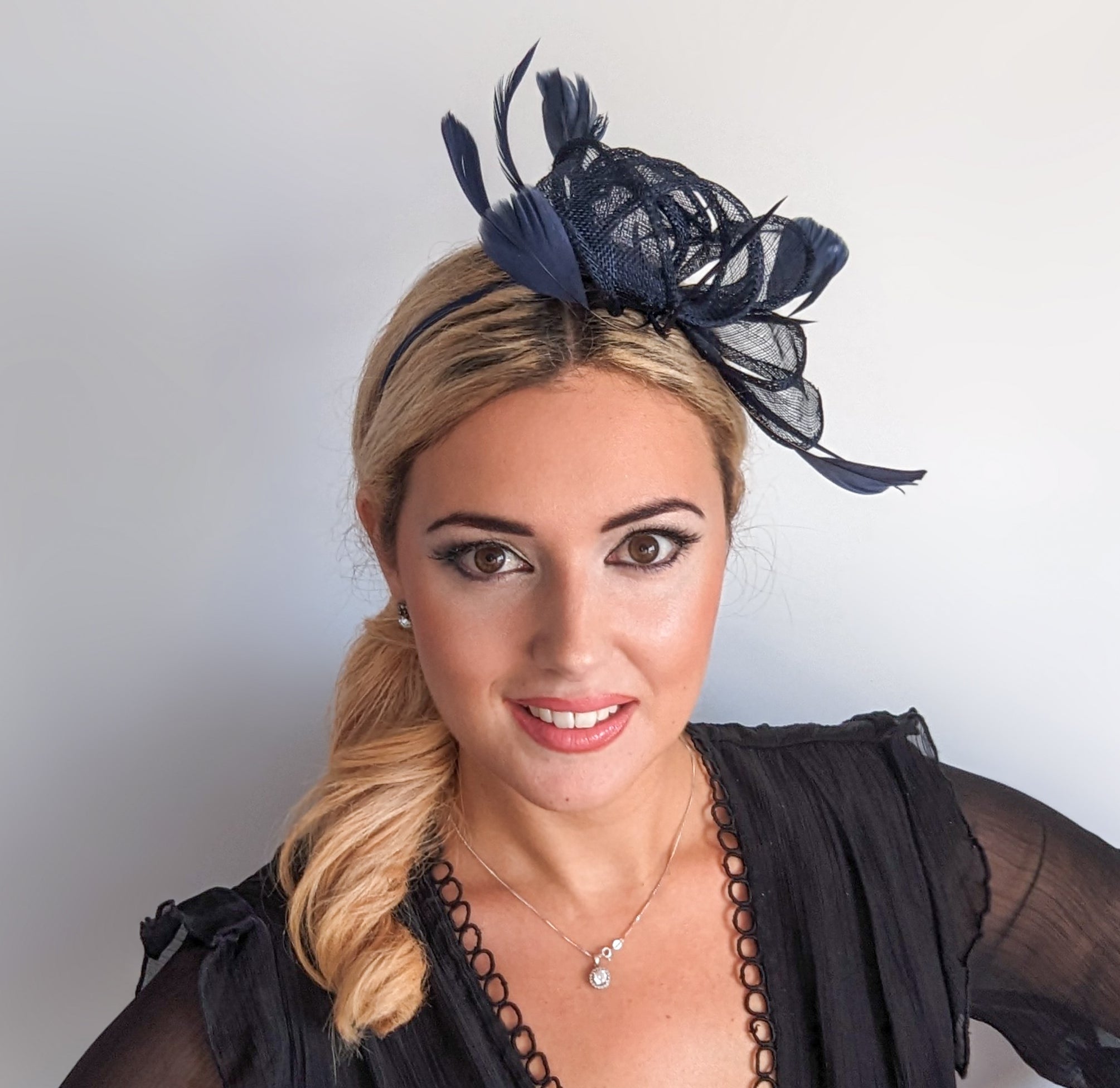 Navy blue feather fascinator hat