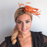 Orange feather fascinator hat