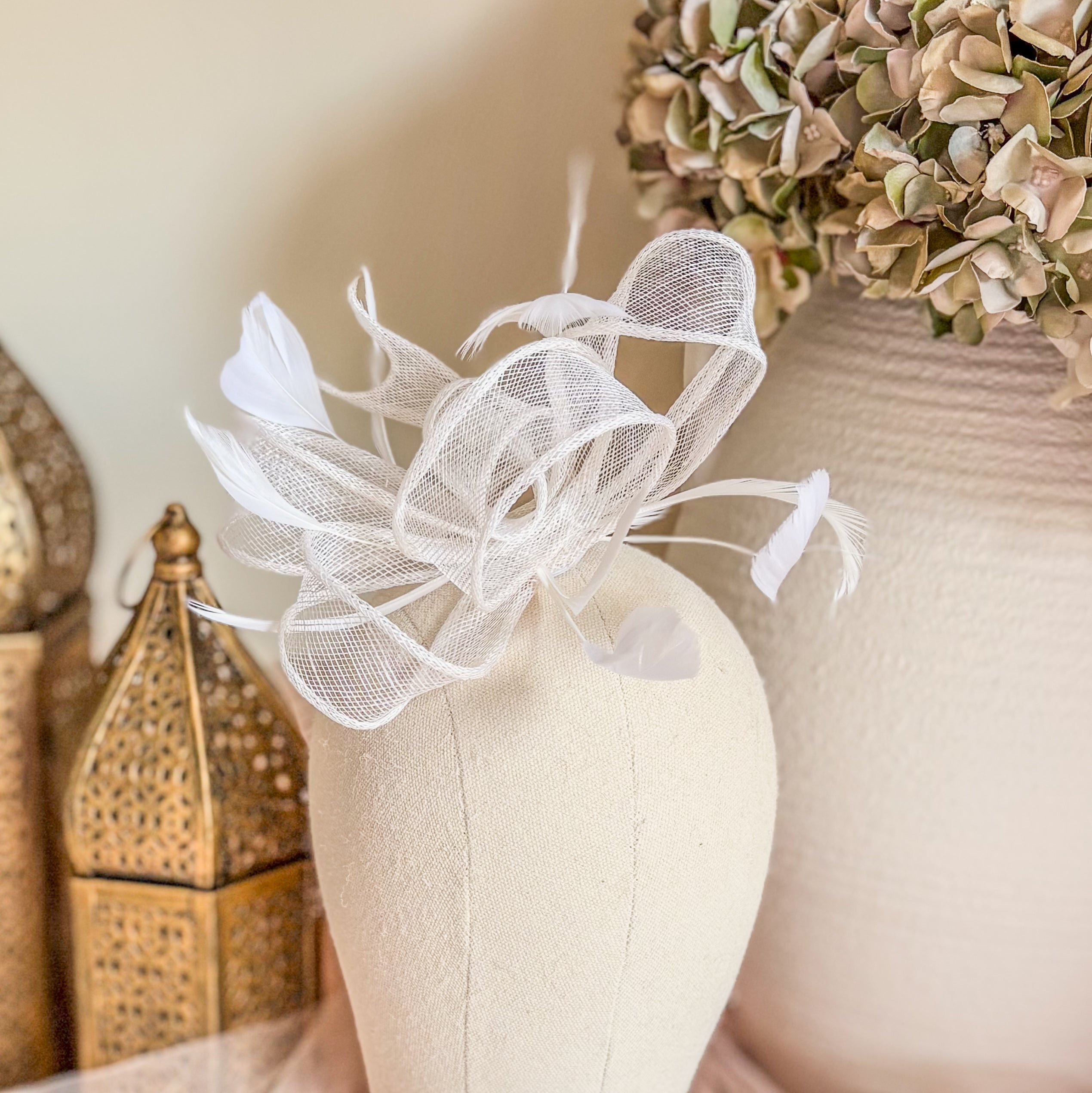 White feather fascinator hat