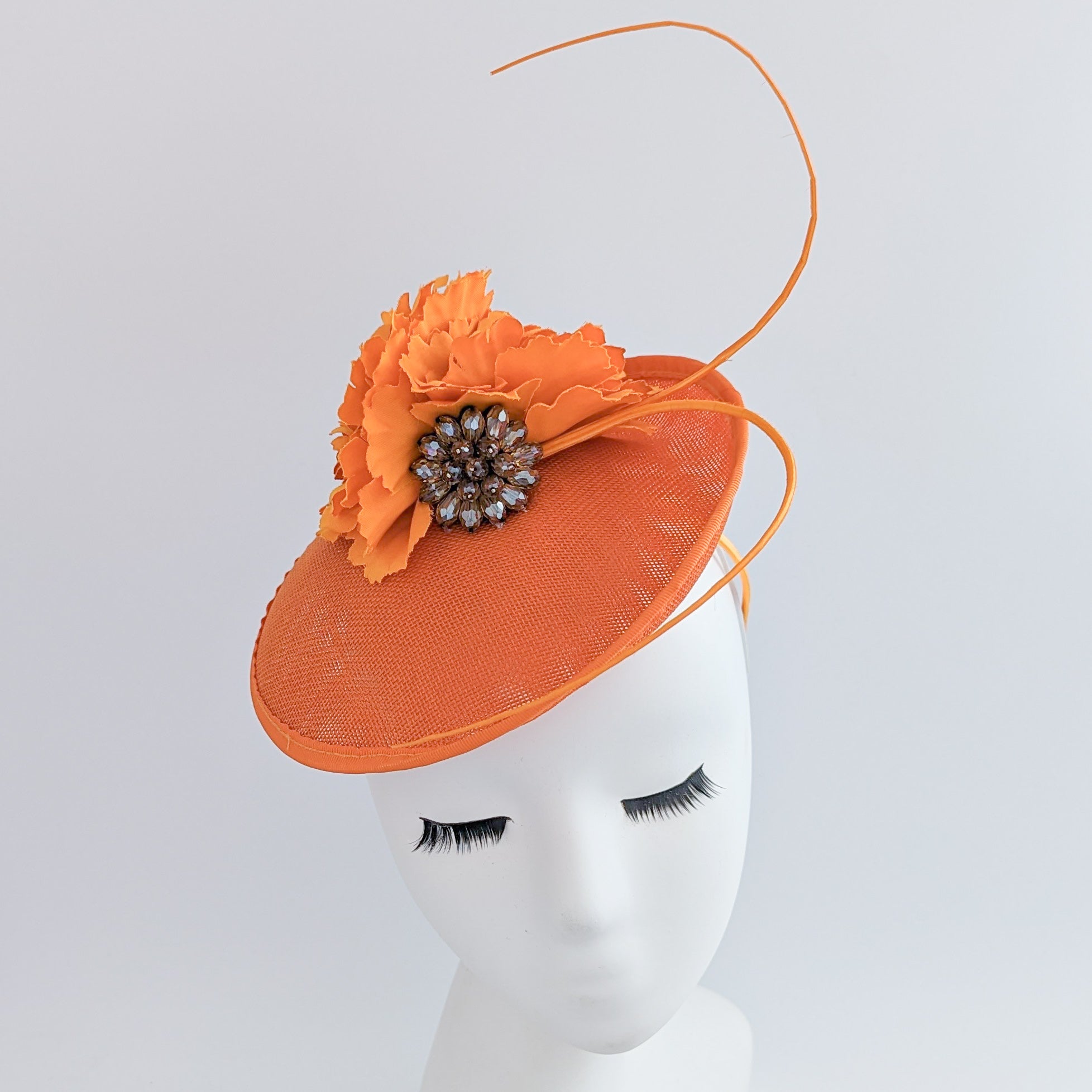 Orange flower disc saucer fascinator hat