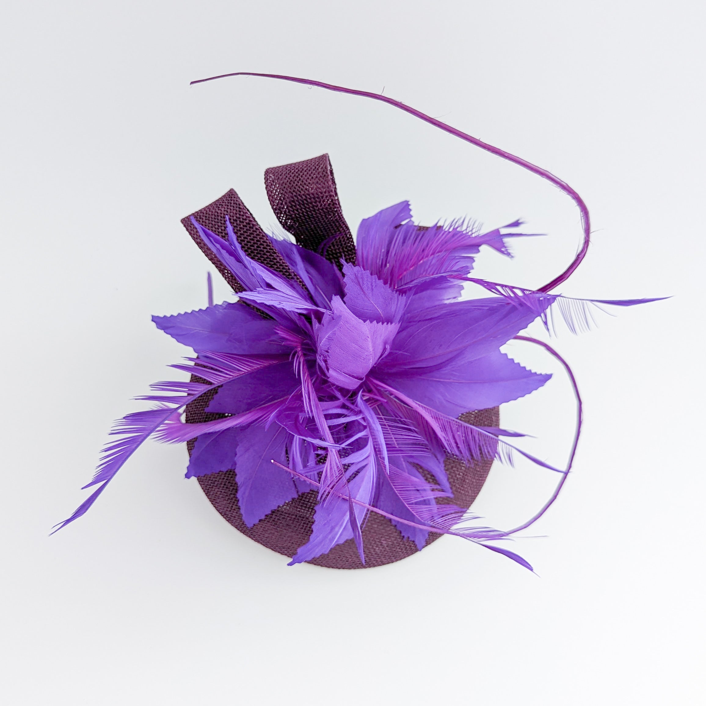 Plum and cadbury purple feather fascinator hat