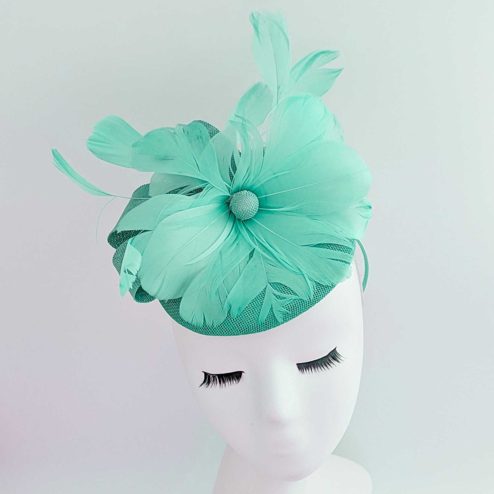 Seafoam mint green feather fascinator hat