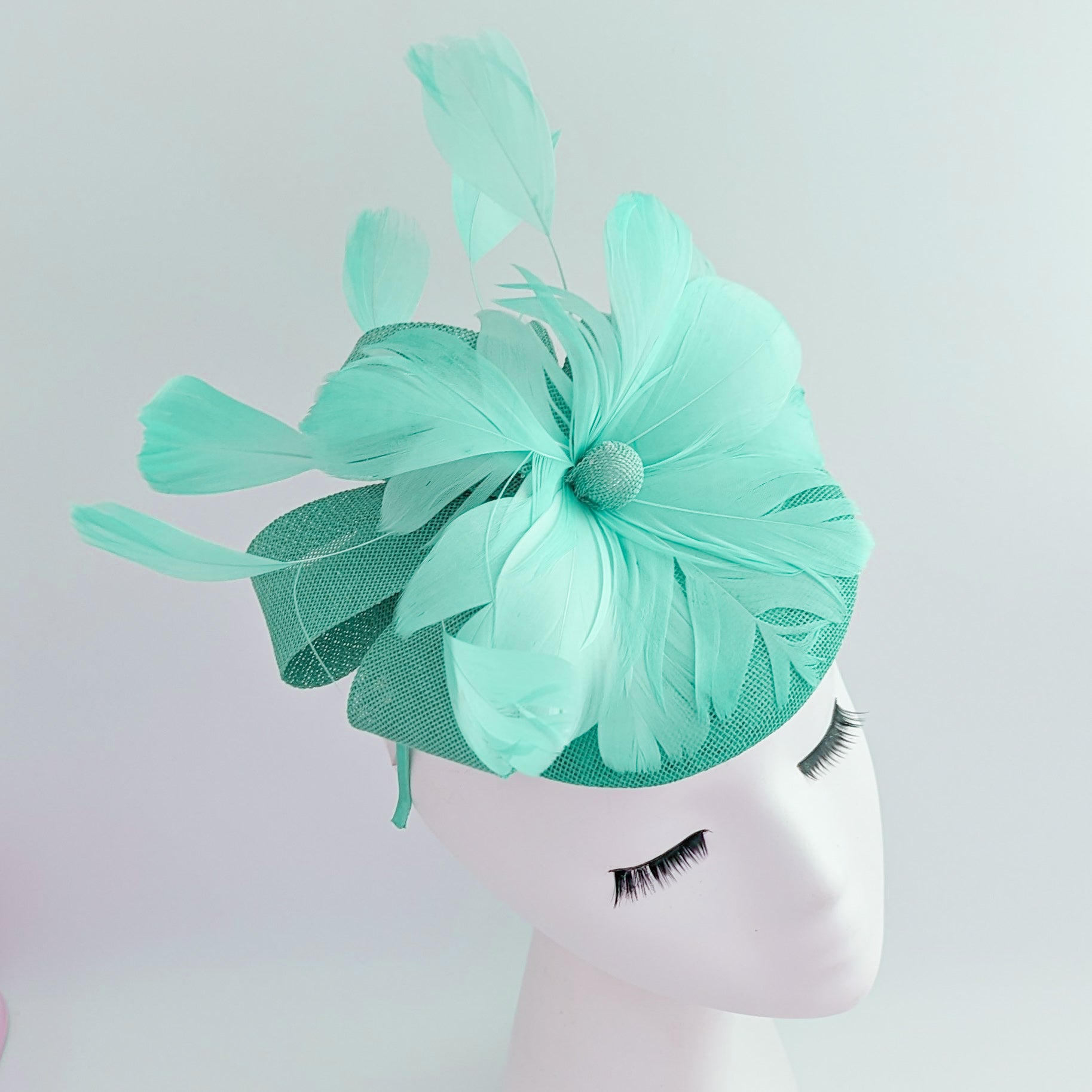 Seafoam mint green feather fascinator hat