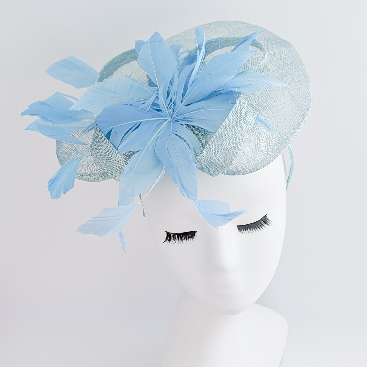 Aquamarine cornflower blue feather fascinator hat