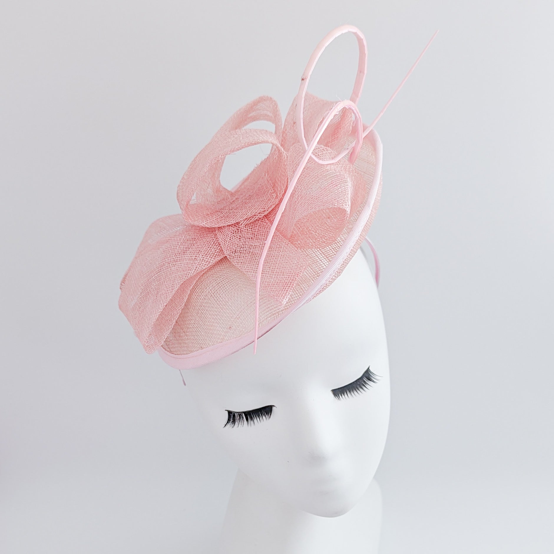 Light pink disc saucer fascinator hat