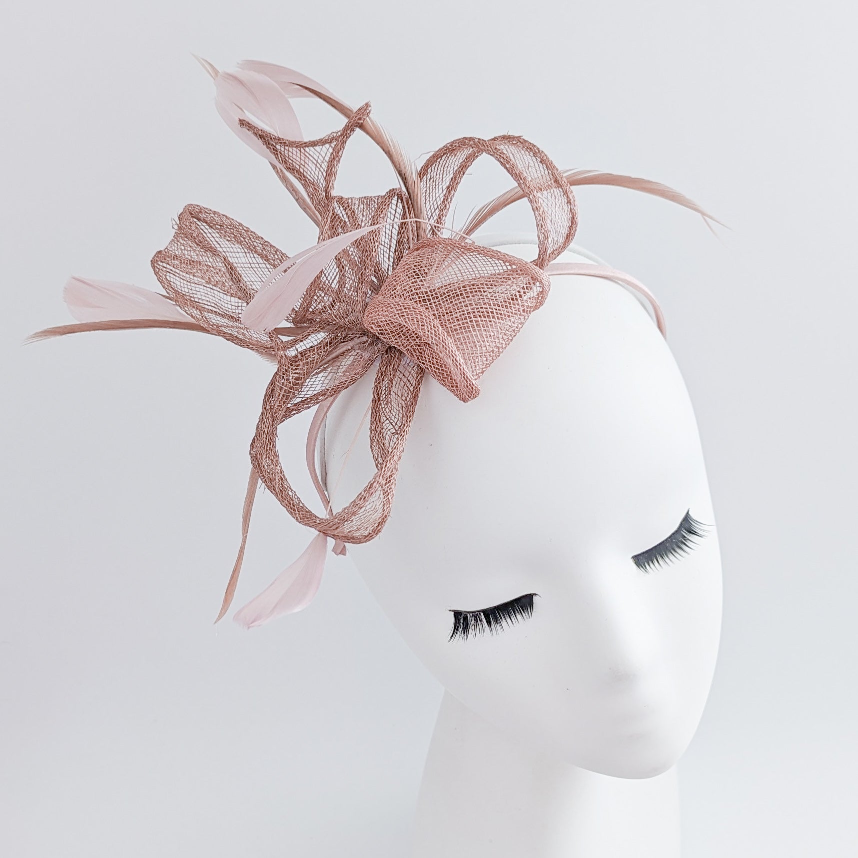 Blush pink feather fascinator hat