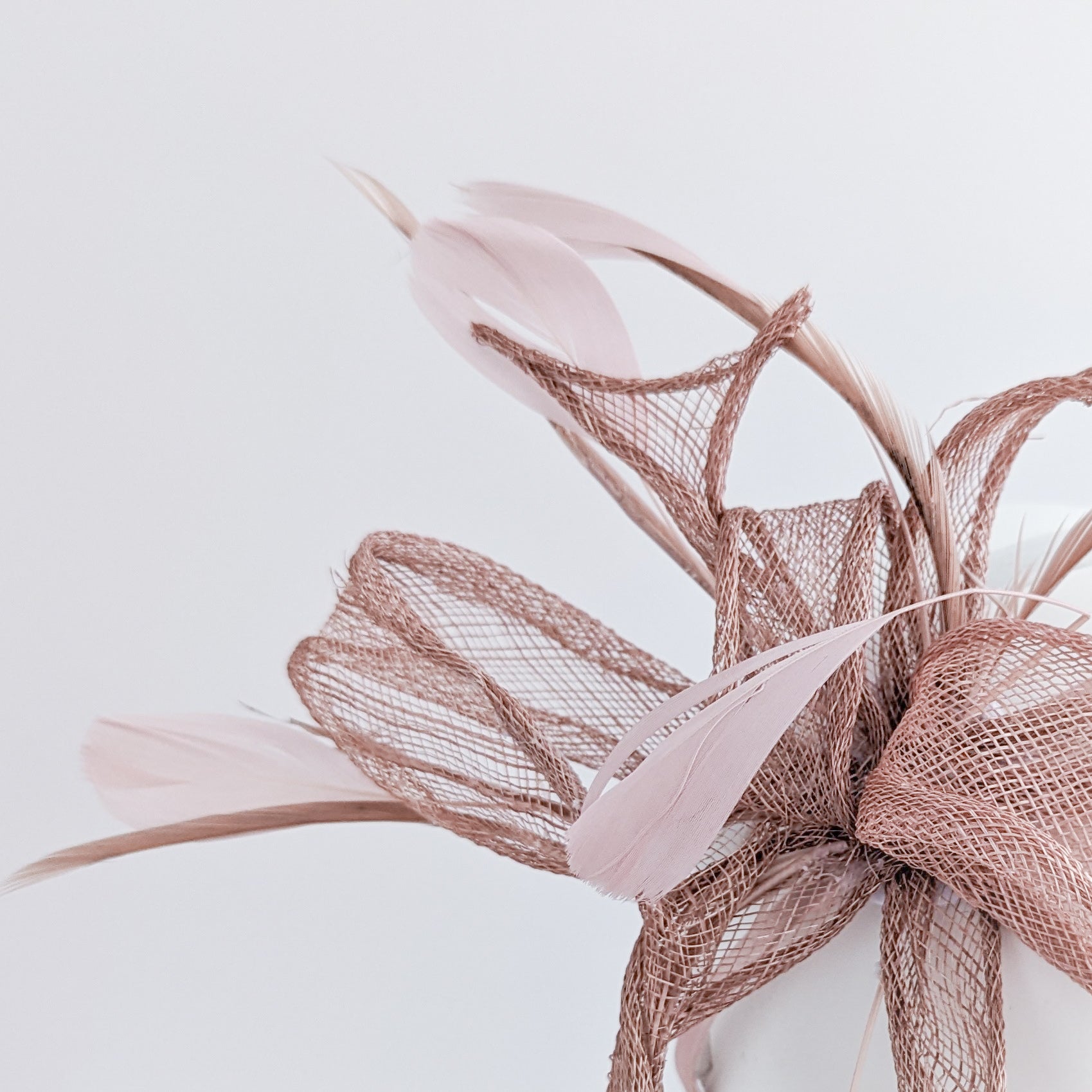 Blush pink feather fascinator hat