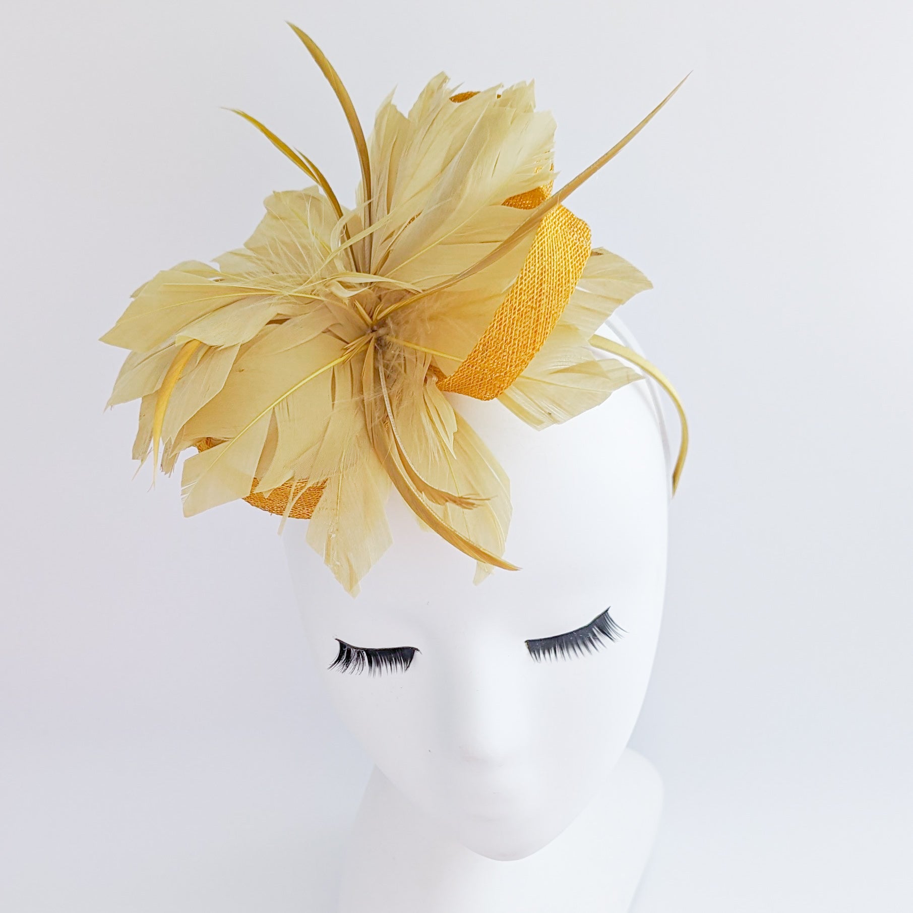 Golden yellow feather fascinator hat