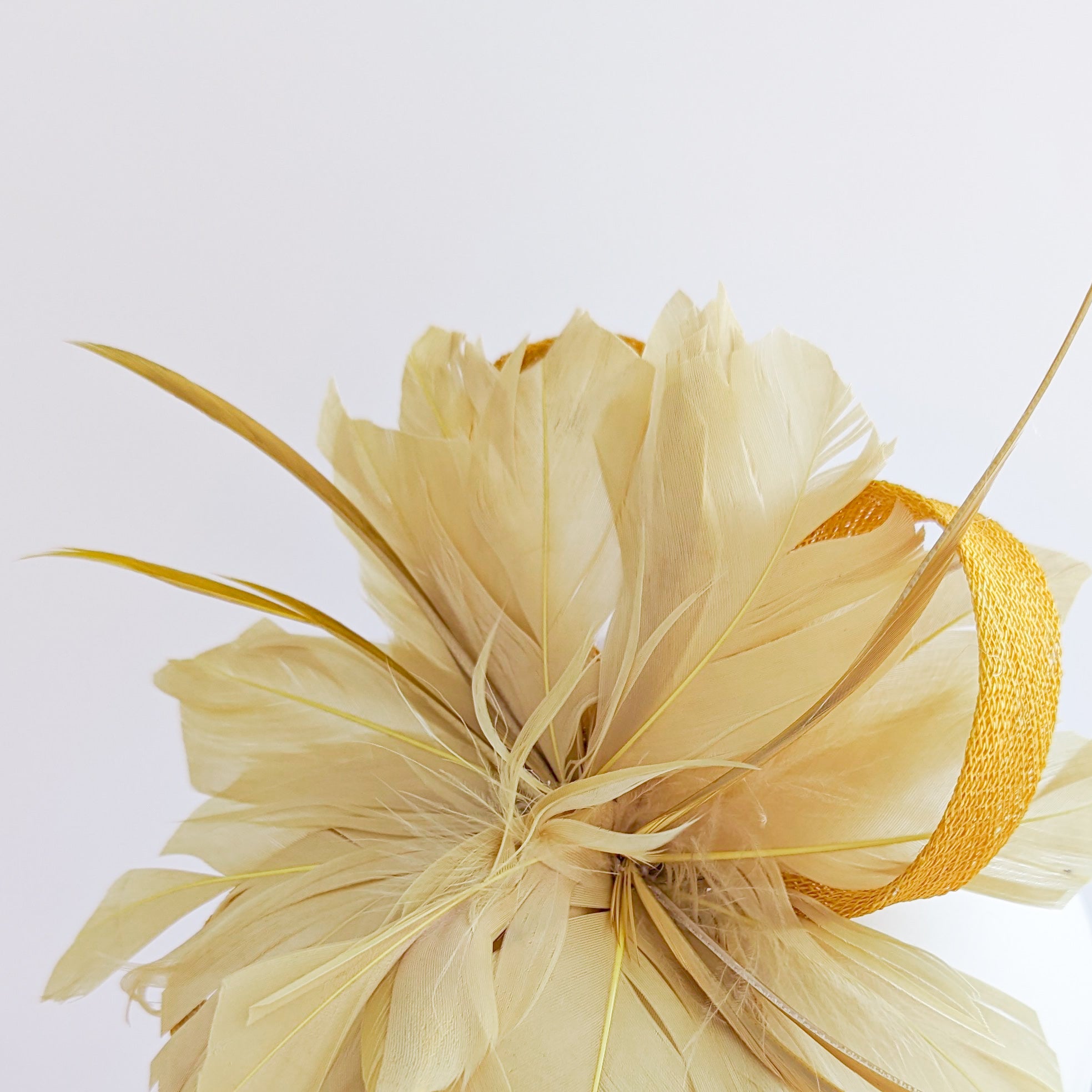 Golden yellow feather fascinator hat