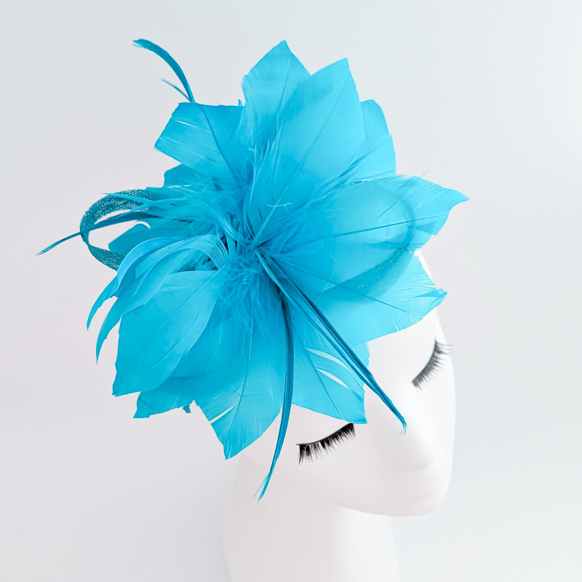 Sea blue feather fascinator hat