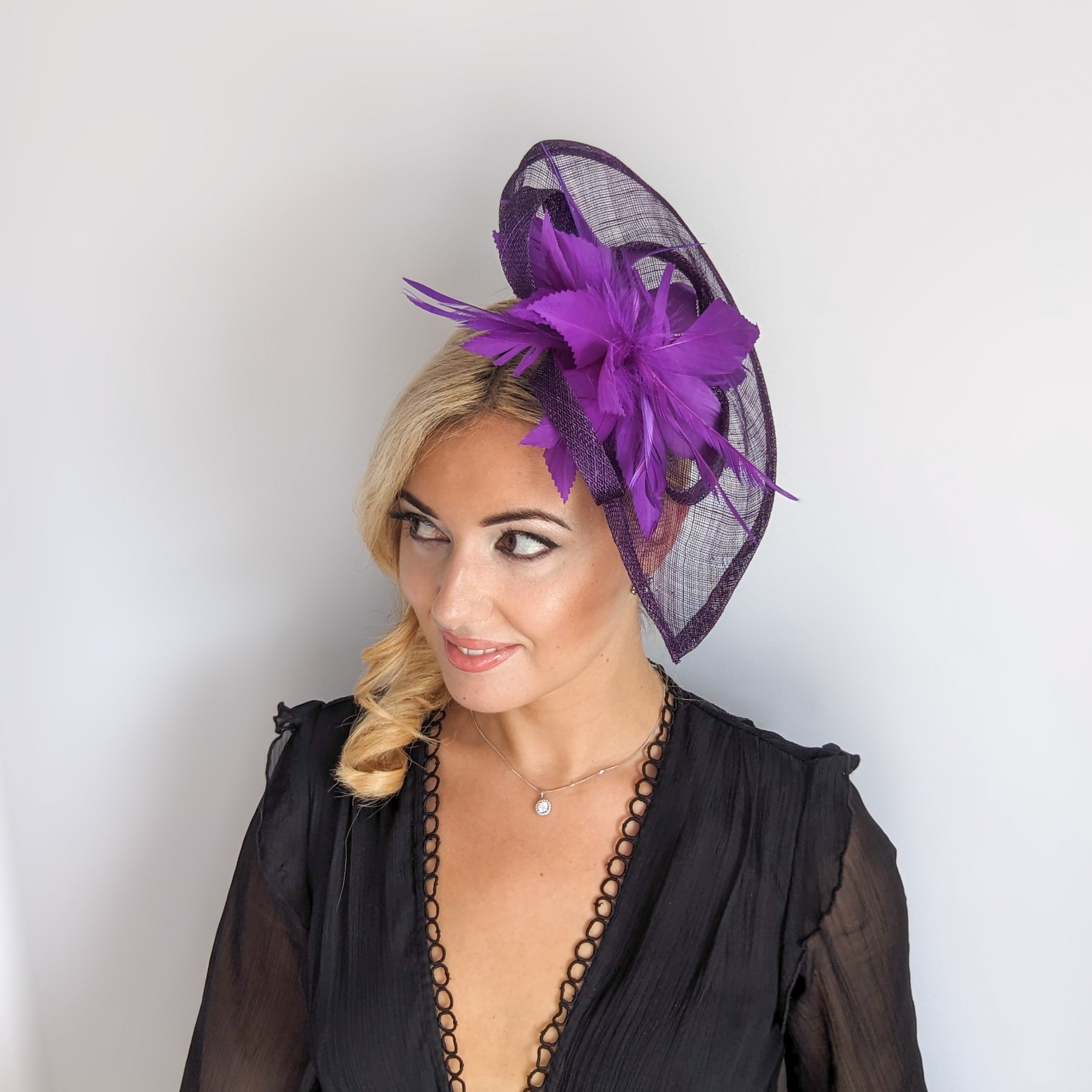 Dark aubergine cadbury purple feather large teardrop fascinator hat