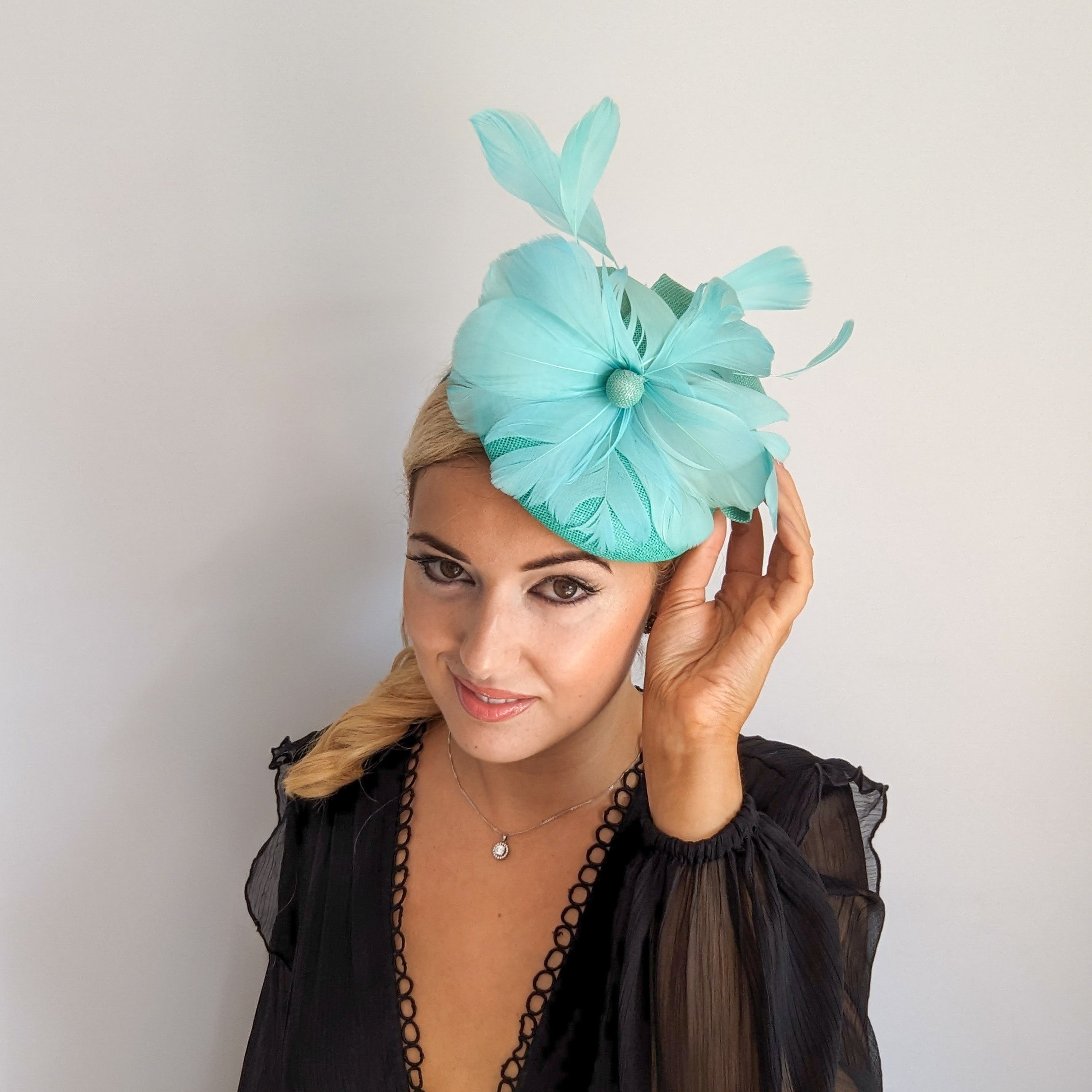 Seafoam mint green feather fascinator hat