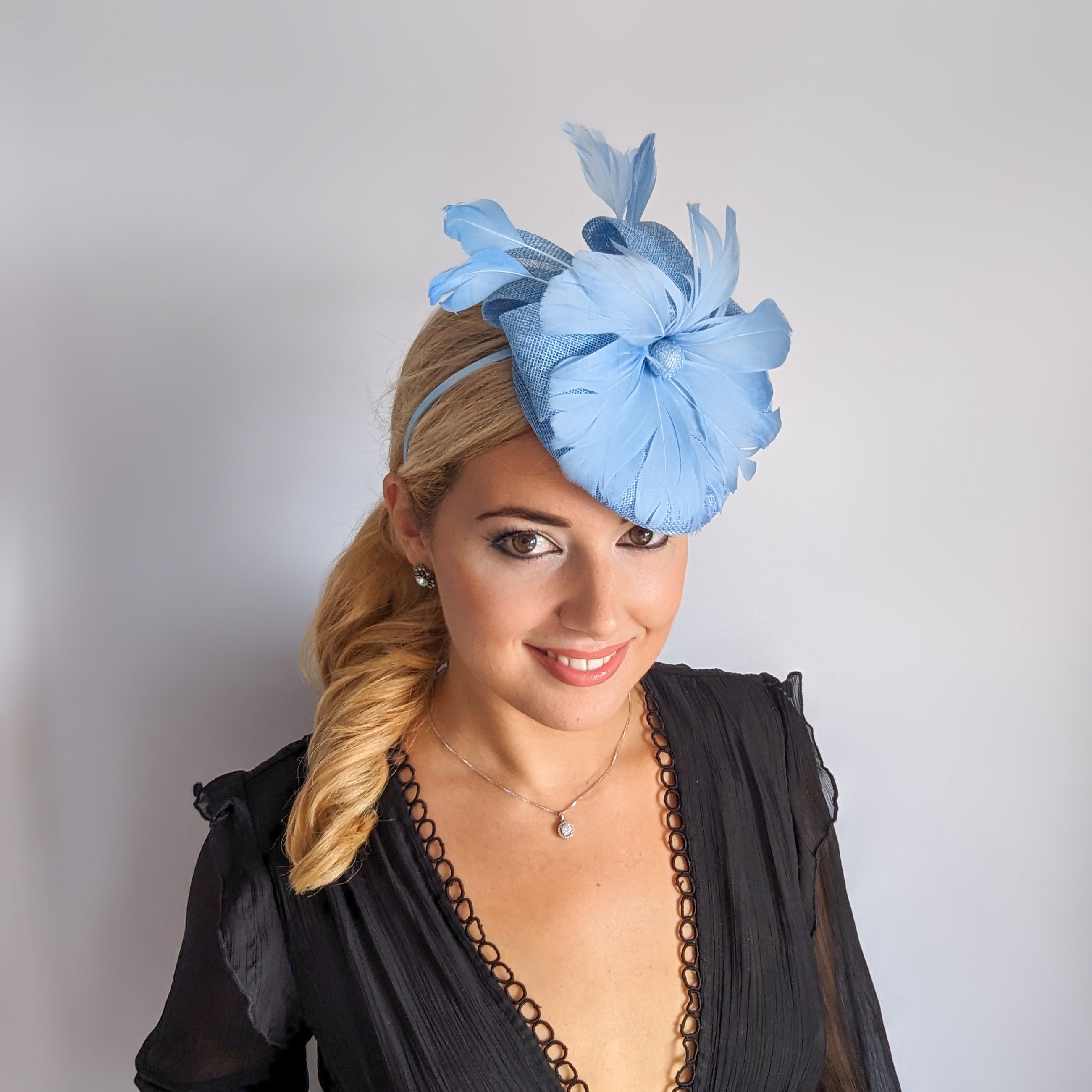 Light cornflower blue feather fascinator hat