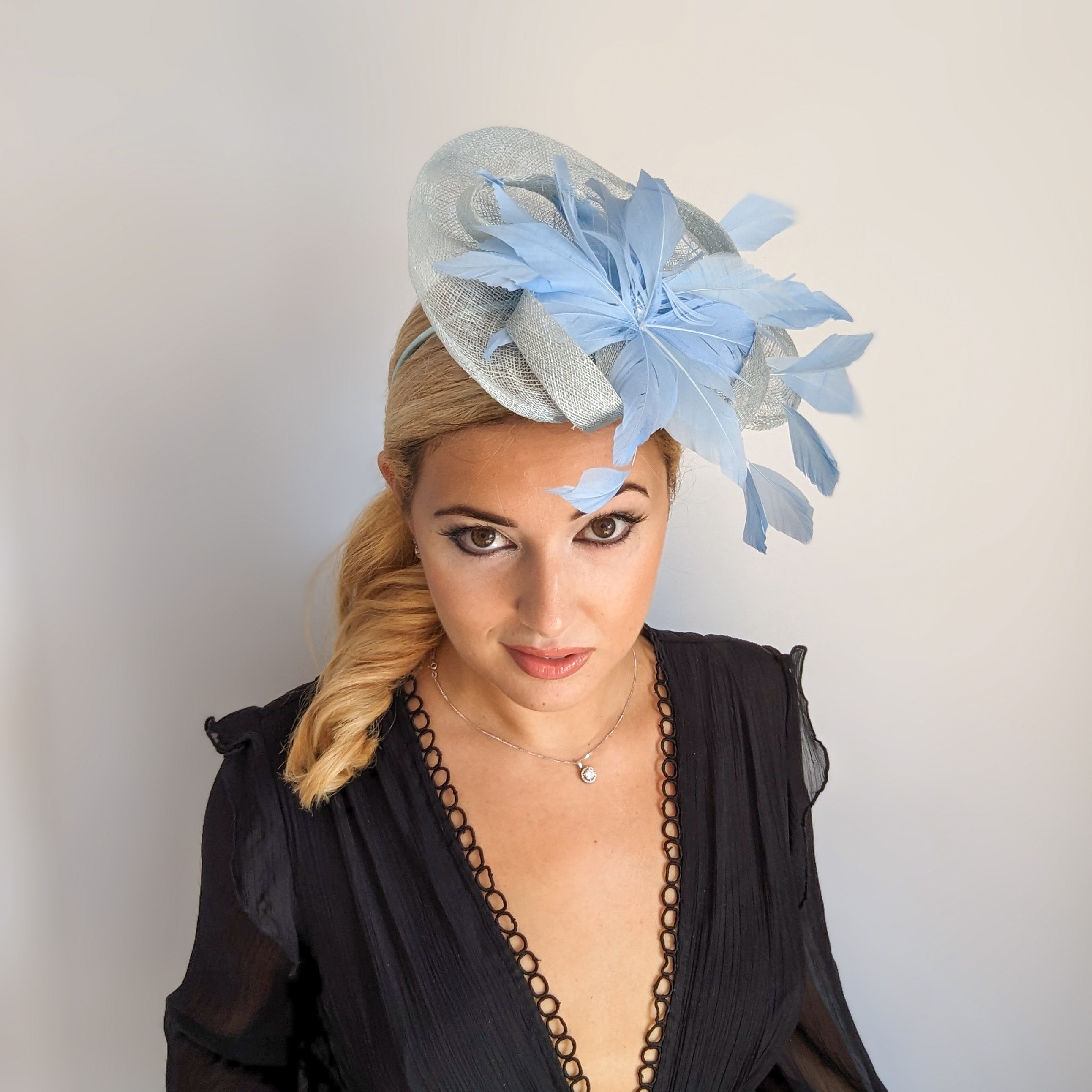 Aquamarine cornflower blue feather fascinator hat