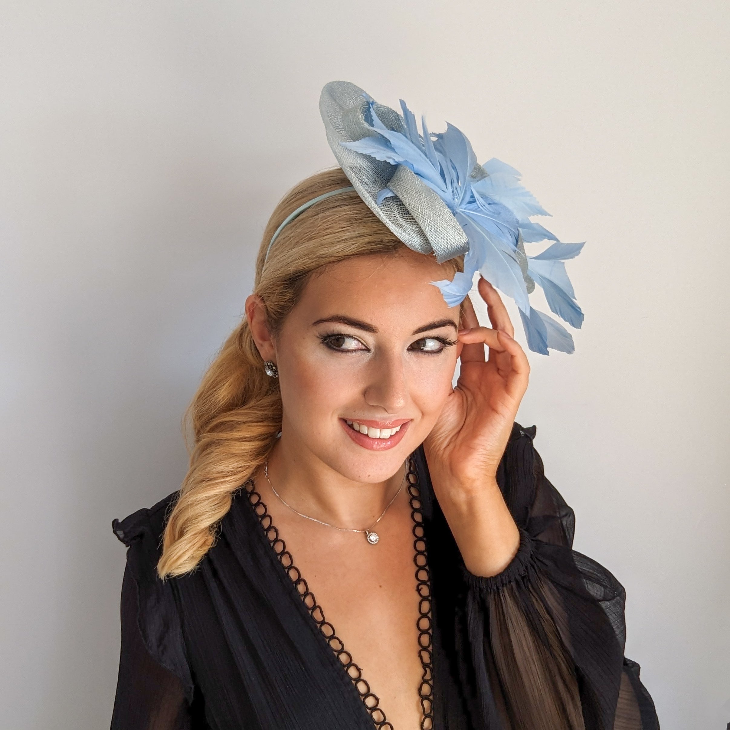 Aquamarine cornflower blue feather fascinator hat