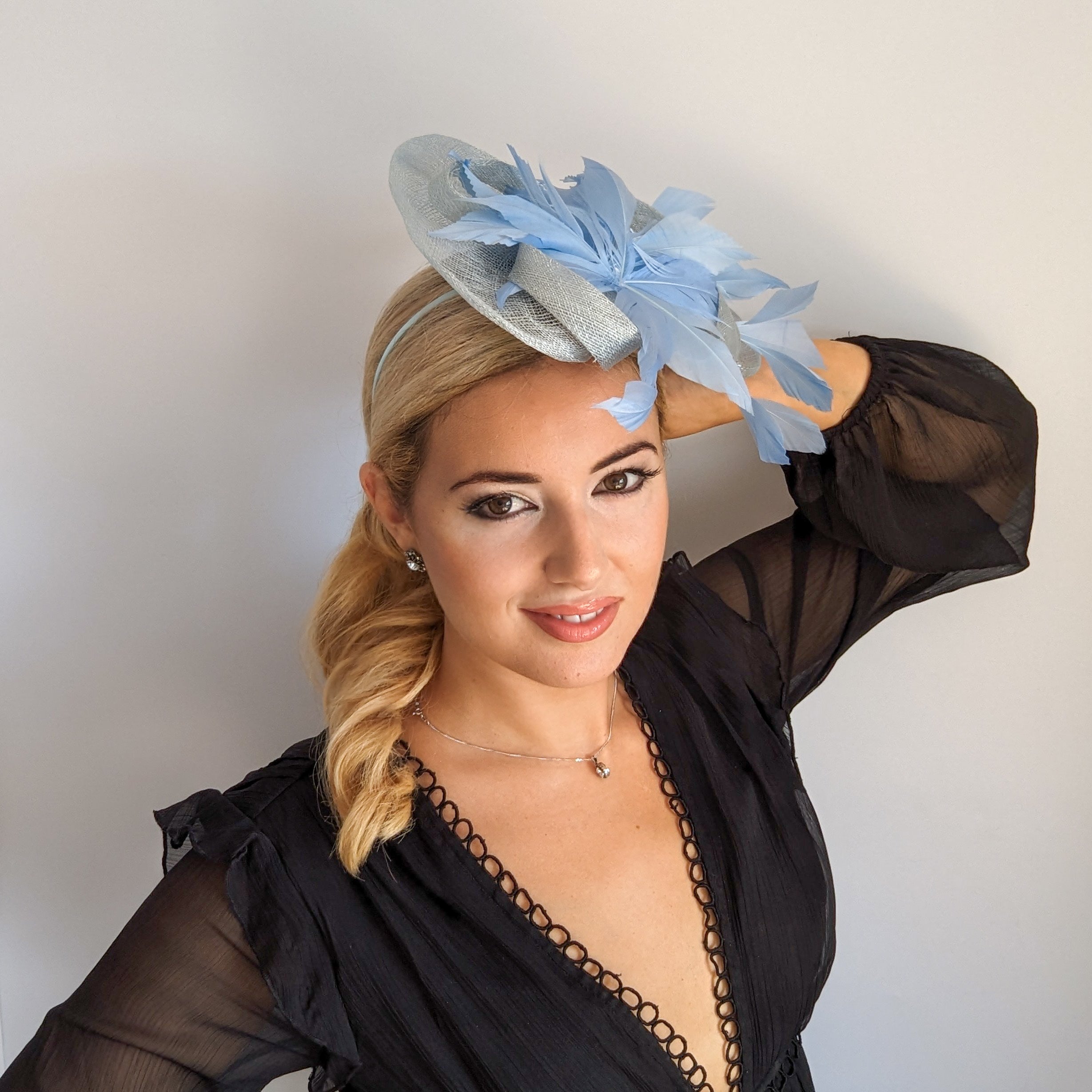 Aquamarine cornflower blue feather fascinator hat