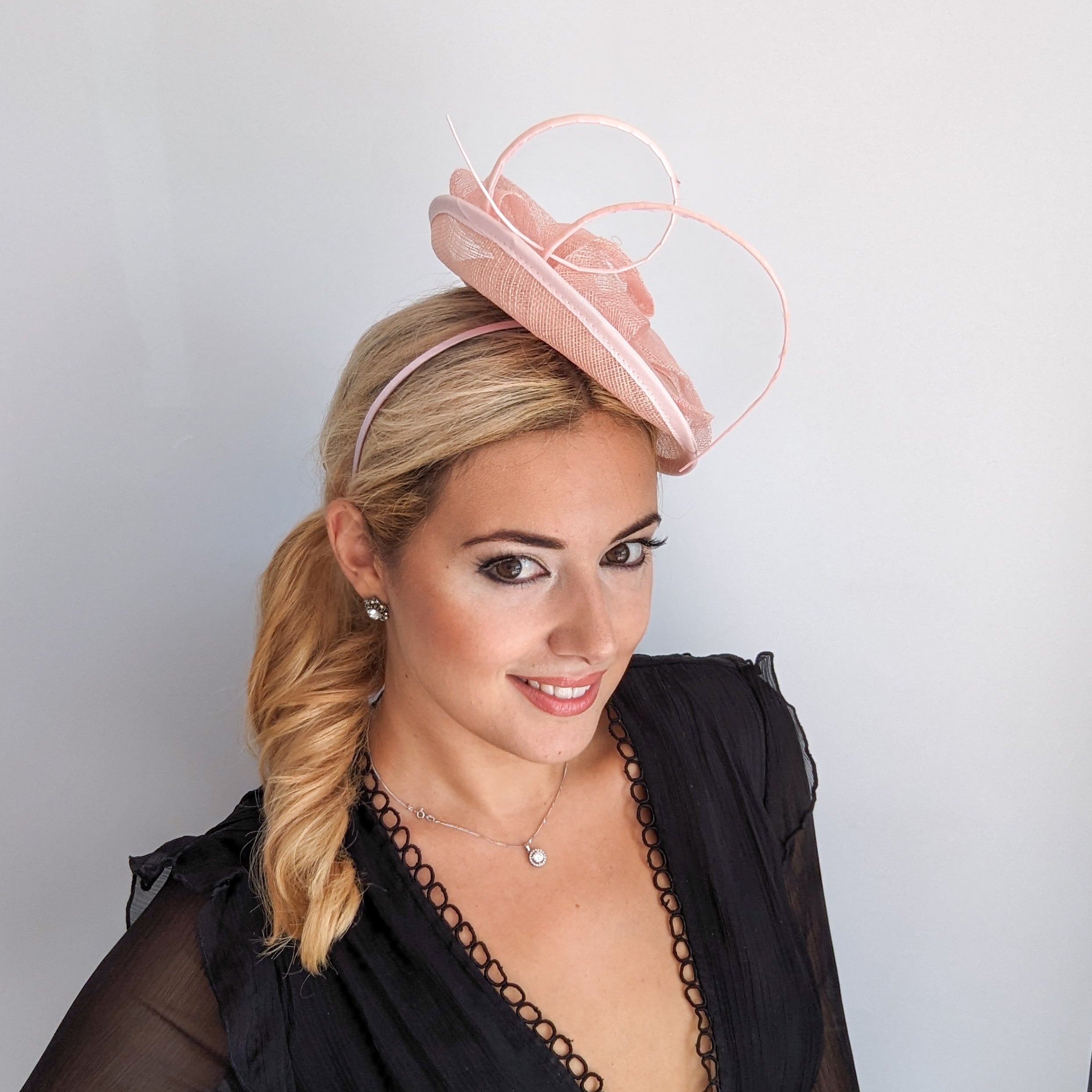 Light pink disc saucer fascinator hat