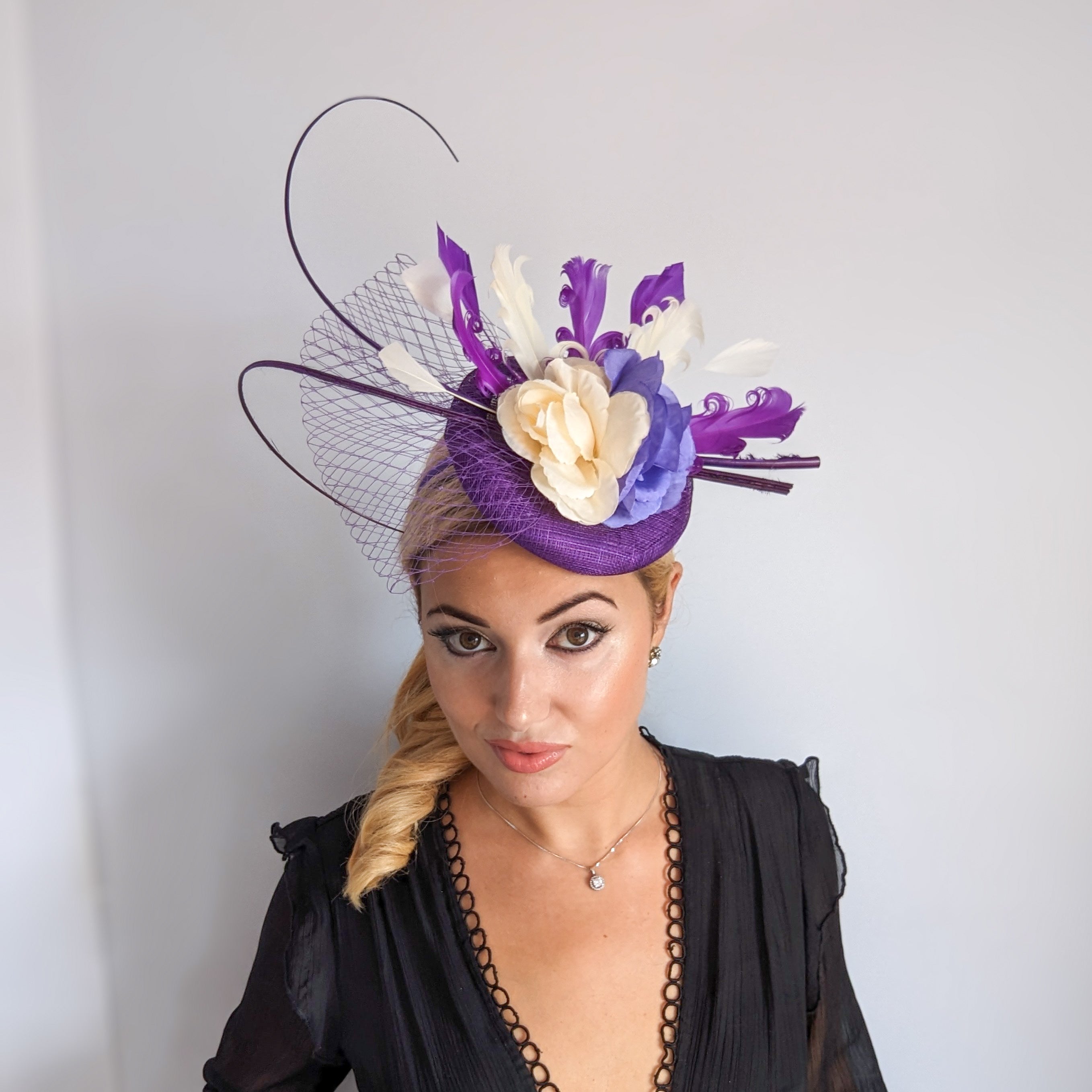 Cadbury purple flower feather fascinator hat