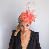 Coral orange feather fascinator hat