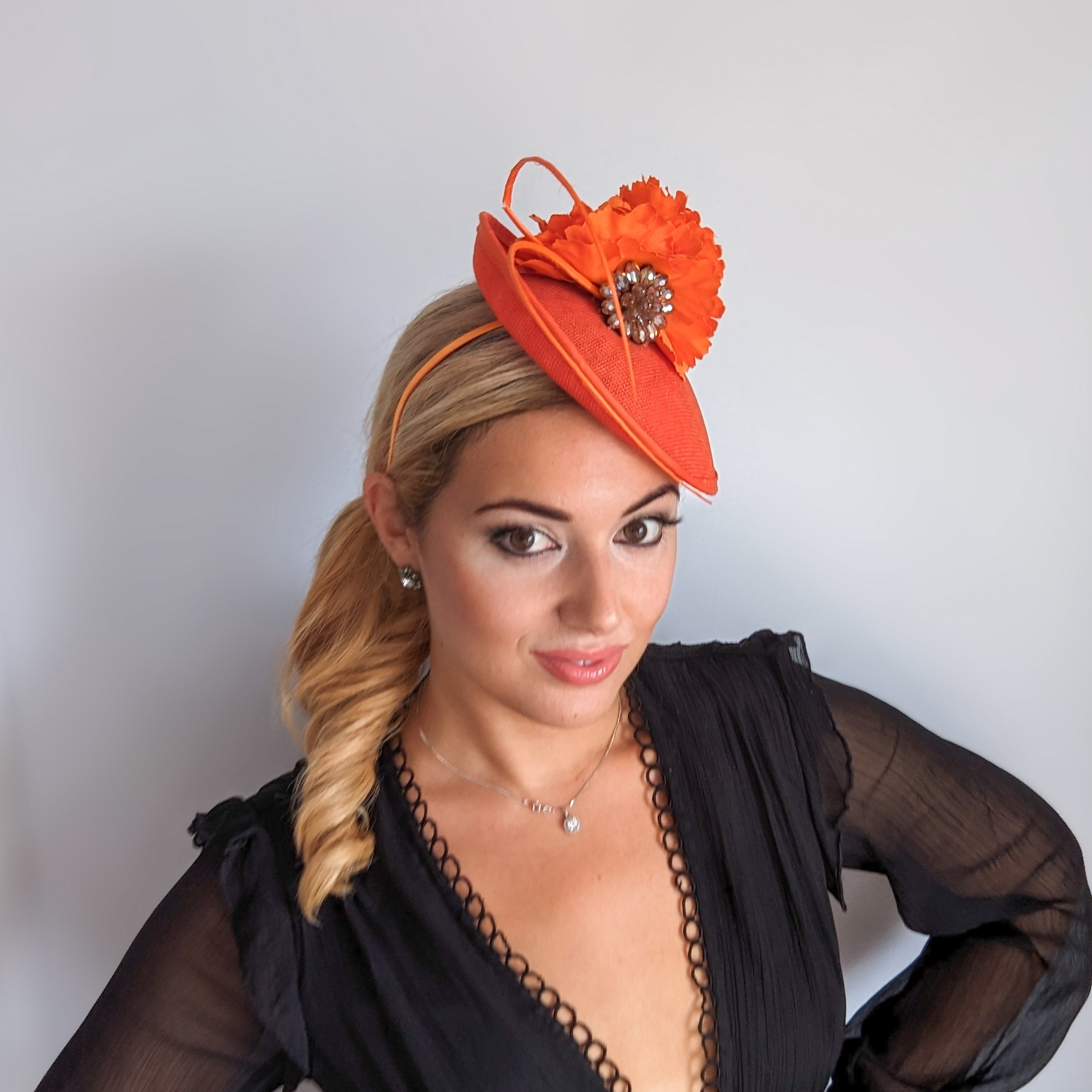 Orange flower disc saucer fascinator hat