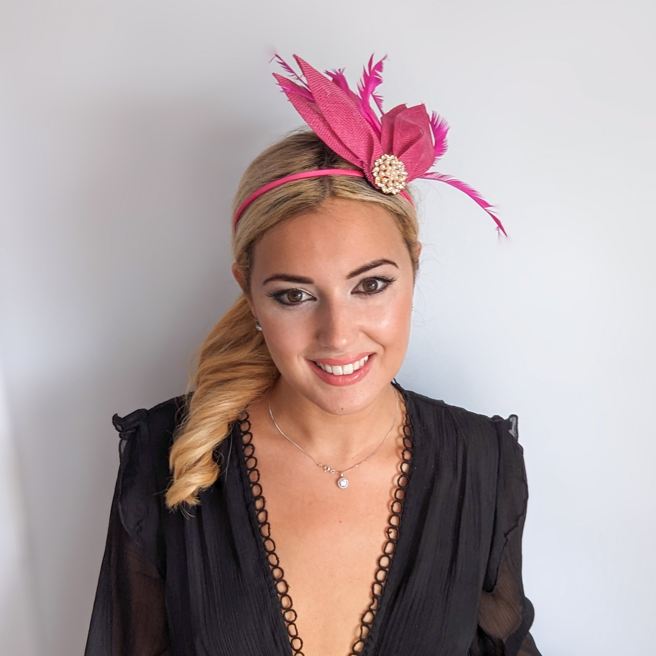 Fuchsia pink feather petal fan fascinator hat