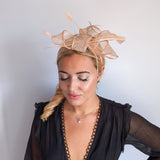 Light peach pink feather fascinator hat