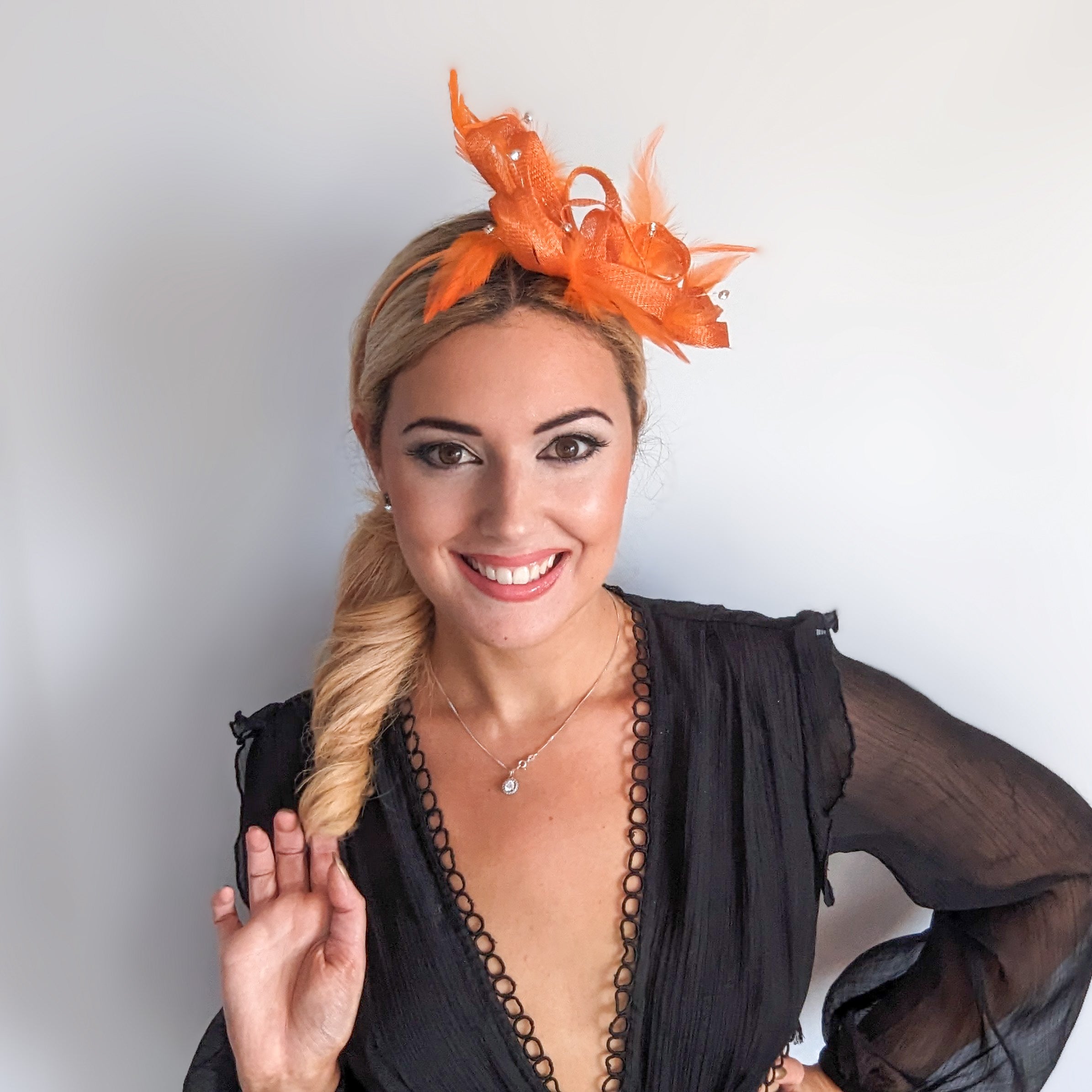 Orange crystal feather fascinator hat